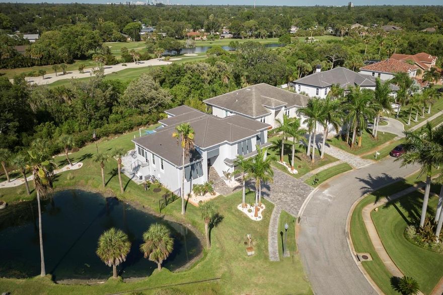 Motivated Seller!!Be a part of Country Club living in this Hurricane proof home!! Must see home in person to see all how beautiful this home is!! The construction pictures and 3D tour of home show a lot of the details though. Beautiful like new (built in 2020) home off the 17th tee of Pasadena Yacht and Country Club is a one of kind! This all concrete and block home is located on an oversized lot . As you walk into the home you will see all the attention to details starting with 10-foot ceilings, large base boards, crown molding and commercial grade windows and sliding doors. Gourmet kitchen includes Viking appliances, 150 bottle cooler, double convection oven, double beverage draws in the dry bar area, pot filler for your gas stove. The kitchen counter tops are quartz and granite with custom backsplash. Dining area with lights of natural light that have plenty of space for a 12-person dining table. Master bedroom has large custom-built walk-in closet, soaking tub and dual head walk in shower.  There is another large bedroom on the first floor and additional full bathroom.  Sellers have added an enclosed sunroom off the large lanai that could be used as an office too.  As you go up the extra wide leather tile staircase you will find 2 additional large bedrooms and full bathroom with walk in shower. On the  expansive lanai there is a fire pit, two gas grills and plenty of space for your outdoor furniture.  Beyond the lanai is a large private backyard with an option for a pool.(see attachments from Oasis Pools) Home is located on a private cul de sac and backyard is gated .  Home is only .6 miles to PYCC where you can take your golfcart to enjoy all the amenities at the club. As a buyer of this home you are entitled to move above the 2 to 3 year wait list at the club and join within 30 days of your purchase for minimal fee.  Location of this home is wonderful as it is only 5 minute drive to downtown Gulfport and 10 minutes to beach and downtown St. Petersburg!  Come enjoy this beautiful home in the gated community of Pasadena Yacht and Country Club!  SELLERS ARE READY TO SELL!  They have purchased another home.