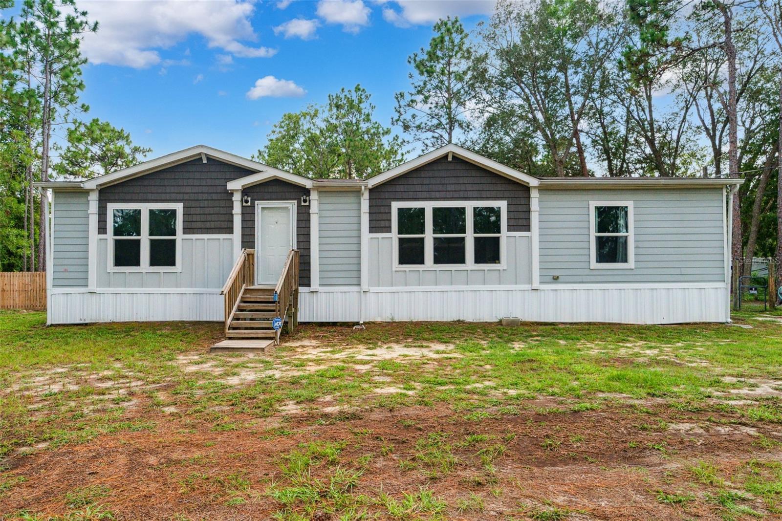 Peaceful country living on one acre, where modern comfort meets country charm! This beautifully maintained 2019 manufactured home sits on a spacious 1-acre lot, offering privacy, open space, and the freedom to enjoy outdoor living.
Inside, you’ll find a bright and functional 3-bedroom, 2-bath layout with an open-concept living and dining area that flows seamlessly into the kitchen, perfect for family time or entertaining.
Step outside and relax on the large covered back porch, ideal for morning coffee, peaceful evenings, or hosting guests. Cool off in the new above-ground pool, or enjoy the wide-open yard with plenty of room for pets, gardening, or outdoor fun.
Ideally located between US-19 and the Suncoast Parkway, you’ll enjoy peaceful country living with easy access to shopping, dining, and major commuter routes — giving you the best of both worlds.
Don’t miss your chance to own this little piece of Florida paradise!