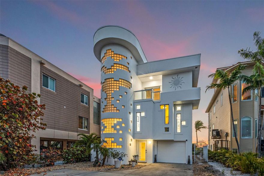 Sunset Beach's iconic "Glass Block Home," envisioned by renowned architect Daniel Thayer Dawson, now graces the market, offering a rare opportunity to own one of the West Coast of Florida's most uniquely designed residences.

Nestled along the pristine shores of the Gulf of Mexico, this ultra-modern three-story masterpiece stands tall with its distinctive 20-foot floor-to-ceiling windows, redefining coastal elegance with sleek lines, minimalist design, and cutting-edge architecture.

Step inside to experience a seamless fusion of form and function. The living room's expansive 20-foot tall windows flood the interior with natural light, providing breathtaking views of the azure waters and golden sunsets that stretch across the Gulf of Mexico. The open-concept layout creates an airy ambiance, perfect for relaxation and entertainment alike.

The kitchen beckons culinary enthusiasts with its state-of-the-art induction cooktop, custom cabinetry, and seating for four guests at the kitchen counter, making it ideal for gatherings. Meanwhile, the spacious living area, adorned with 20-foot high ceilings and designer finishes, offers the ultimate setting for hosting guests or luxuriating in comfort.

Retreat to the serene master suite, where tranquility awaits amidst sweeping ocean vistas. Wake up to breathtaking views and unwind in the ensuite bath, complete with a walk-in shower. Step outside the Master to its own private porch to enjoy sunsets or gaze at the full moon as it reflects off the waters of the Gulf. A floating glass walkway, with its own stunning water views, provides access to the third-floor guest bedroom, boasting its own incredible beach views. The home's additional bedroom is also located on the third floor.  Each of these bedrooms has its own ensuite and private porch with stunning views, providing comfort and privacy for family and guests.

Outside, a private beach oasis awaits, offering opportunities to lounge on the home's many expansive, sun-drenched decks, each adorned with custom glass railings to preserve the stunning views. Or, dine alfresco under the stars. With direct access to the beach, every day feels like a vacation in paradise.

Adding to the allure, a magnificent glass elevator seamlessly connects all three floors of the home, enhancing both convenience and luxury. On the ground floor, a freshly painted two-car garage with new two-part epoxy commercial coating awaits, along with a generous home gym room and ample storage space. Exiting from the rear garage door, you'll find a beautiful lanai providing access to both the beach and a spiral staircase leading up to the main living levels.

Just a two-minute walk up the beach, you'll find yourself at the renowned beachfront Caddy's Restaurant. Additionally, you can enjoy the vibrant atmosphere of the famous Ka'-Tiki Bar/Restaurant, which has been offering live music 7 days a week for the past 32 years. By the way, their cheeseburgers are only $3, so you'll save money eating out here!  So, whether you're seeking a tranquil beach experience or craving something a bit more lively, this home's location is perfect for both preferences. Book your private appointment today to tour Sunset Beach's own Glass Block House.