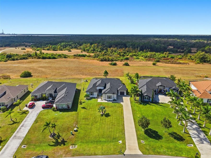 One or more photo(s) has been virtually staged. Discover your dream home in the exclusive, gated Lake Toscana community. Set on a generous 0.52-acre lot, this residence is surrounded by the natural beauty, open spaces, and wildlife that give the neighborhood its Italian-countryside charm. With only 127 homes—each on half- to full-acre lots with conservation or lake views—you’ll appreciate unmatched privacy and tranquility.
This quality-built home offers 3 bedrooms, a versatile den, 3 full baths plus a powder room, and a spacious split 3-car oversized garage. The gourmet kitchen impresses with a vent hood, walk-in pantry, island, wine cooler, light wood-tone cabinetry, Athena marble countertops, and a honed marble backsplash. The bright primary suite features abundant windows, a luxurious bath with dual sinks, vanity, walk-in closet, frameless shower, and rain shower head. The great room opens to a screened pool area overlooking serene conservation views—ideal for relaxing or entertaining. Ten-foot ceilings with 14-foot tray accents elevate the great room and primary suite.
Additional features include a large walk-in pantry, an expansive laundry room, and a private ensuite bath for bedroom 3. The screened-in pool and spacious backyard offer the perfect setting for outdoor living. The home operates on well and septic, with irrigation running from the well for added cost savings. Community amenities include walking trails, a pavilion, and easy access to canoeing, fishing, and nature activities at nearby Little Manatee River State Park.
With low HOA fees, no CDD, and convenient access to Tampa and Sarasota, this home offers the ideal blend of serenity, space, and exceptional craftsmanship. Don’t miss this rare opportunity to own an estate in one of Tampa Bay’s most desirable nature-focused communities.

Don't forget to check out the property and community video.