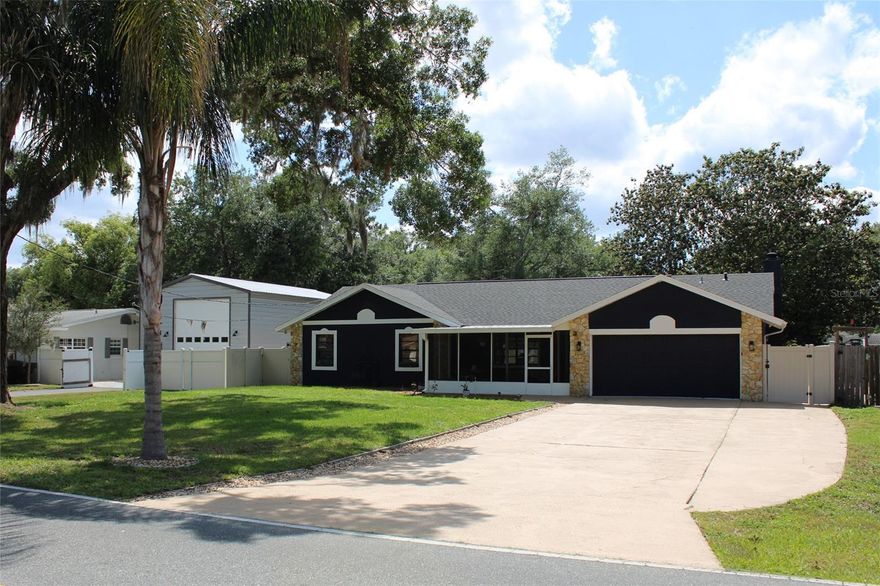 Welcome to your fully updated and move in ready waterfront retreat! This 5 bedroom, 3 bath waterfront home offers the best of Central Florida living. Situated on a canal with access to the Harris Chain of Lakes, this property is a true boater’s and angler’s paradise with plenty of room for family, guests, entertaining, or working from home. The oversized driveway provides plenty of parking for large families or social gatherings. Recent upgrades include a new roof in March 2026 and two new A/C units installed in September 2024. The spacious primary suite features an updated bathroom with two sinks and a luxurious master shower with two shower heads. The home has been thoughtfully refreshed and updated for modern comfort and style throughout. With no HOA, you can enjoy the freedom to bring your boat, enjoy the waterfront lifestyle, and make the most of this exceptional setting. Located in desirable Lake County, this home offers easy access to historic downtown Mount Dora (by boat or car), Orlando, Disney, shopping, dining, and Florida’s famous attractions, while still giving you the charm and space of waterfront living. If you’ve been looking for updated waterfront living with room to spread out and direct access to one of Central Florida’s most beloved lake chains, this is the one.