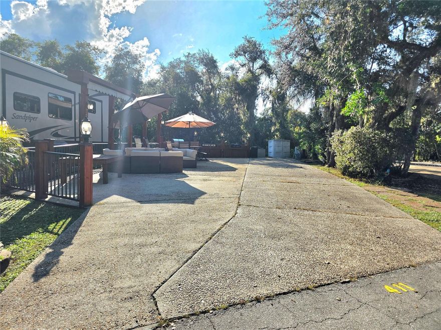 Welcome to your own slice of paradise at the exclusive River Ranch RV Resort – one of Central Florida’s most sought-after luxury RV destinations. This turnkey RV lot, located in Phase 4, is just steps away from resort amenities including the pool, restrooms, showers, and laundry facilities – offering both convenience and comfort.
Outdoor "Camping" at Its Best:
This beautifully upgraded lot features a fully equipped outdoor kitchen, complete with a grill, and outdoor dining table – ideal for entertaining or unwinding under the stars. The lot is thoughtfully furnished with comfortable seating, plentiful outdoor furniture, and large umbrellas for shade, making it the perfect retreat year-round.
Private Setting: Enjoy peaceful views with no rear neighbors, offering added privacy and a serene atmosphere surrounded by lush landscaping.
Prime Location:  Just around the corner, indulge in all the fun and excitement at Westgate River Ranch Resort, where you'll find on-site restaurants, adventure activities, a water park, and more (additional fees apply). As a River Ranch RV Resort owner, you’ll benefit from exclusive discounts at Westgate's dining venues and water park.
Whether you're looking for a weekend escape, seasonal getaway, or income-generating investment, 411 Longhorn Drive is your opportunity to own in a community where luxury meets outdoor lifestyle.