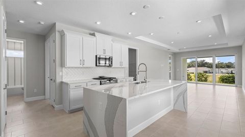 Tiny photo for 574 Hammock Oaks Boulevard, Lady Lake, FL 32159 (MLS # W7884331)