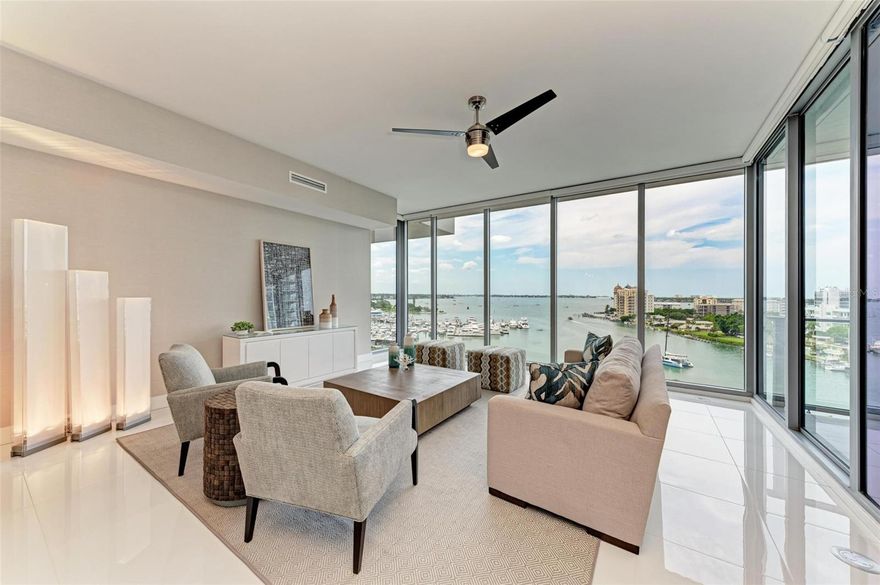 The Vue never disappoints.  From the moment you enter the residence from your private elevator foyer, you will be greeted by breathtaking views of Sarasota Bay out to Big Pass and the Gulf of Mexico.  Relax, escape, and unwind from everyday life in this 8th-floor 2BR plus Den, 2.5 BA, furnished modern condo conveniently located in downtown Sarasota within walking distance to a vibrant culinary, cultural, and art scene.  As you enter this bright and open residence, you are immediately drawn to unobstructed panoramic water views through the 10' floor-to-ceiling hurricane impact windows surrounding the living room, dining room, and open kitchen.  Walk through the living room sliding door to a large center balcony and feel the warm bay breezes.  Modern appointments include large white porcelain tile in the main living areas and den and light European Oak wood floors in the bedrooms.  The open gourmet kitchen offers stylish two-tone European cabinets, built-in appliances, Quartz counters, a large waterfall edge center island, and a designer backsplash.  The primary bedroom suite includes a sliding door to the balcony and expansive water views, a spacious bath with double vanities, a walk-in shower, and a large custom-finished closet.  The private guest suite has an en-suite bath with a soaking tub/shower combination and beautiful marble look porcelain tile.  An open but private den offers space for an office, TV viewing, and a pull-out sofa.  The Vue offers residents first-class services and amenities, including valet parking, 24-hour concierge, a resort-style pool and spa, a grill pavilion and fire pit, a state-of-the-art fitness center, a club lounge, a board room, and a dog park.  This exceptional residence comes with 2 covered parking spaces and air-conditioned storage.  Call today for your private showing! Room Feature: Linen Closet In Bath (Primary Bedroom).