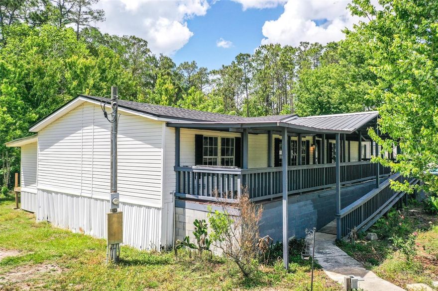 One or more photo(s) has been virtually staged. Discover peaceful country living in Polk City! This well-maintained 3-bedroom, 2-bath mobile home with a BRAND NEW ROOF features a spacious open floor plan with two large living areas, offering plenty of room to relax and entertain. Brand new durable vinyl flooring runs throughout the home for easy maintenance and a clean, modern look.



The primary suite includes a private en suite bathroom and a walk-in closet for added comfort and convenience. An enclosed 264 square foot bonus space provides endless possibilities—perfect for a home office, hobby room, or additional living area.



Step outside and enjoy the large, covered front porch, thoughtfully designed with handicap accessibility. The home also includes a dedicated laundry room, plus a storage shed for extra space.



Ideally located in a quiet, rural setting, this property offers privacy while still being conveniently close to major roadways including Highway 33 and I-4, making commutes to Orlando, Lakeland, and surrounding areas a breeze. Enjoy nearby outdoor recreation at Lake Agnes, the Van Fleet Trail, and several local parks, perfect for boating, biking, and nature lovers. Shopping, dining, and everyday conveniences are just a short drive away, giving you the perfect balance of country living with city access.