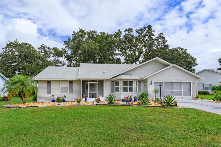 Extremely Well Maintained Lake Highlands 55+ Community 3 bedroom, 2 bath home - don't miss this one!!! Beautifully landscaped Front Yard leads you to the Screened Front Door Entryway and large Foyer with Coat Closet. This open floor plan has Great Room with Cathedral Ceiling, Skylights and built-in Corner Cabinet that opens to well laid out Eat In Kitchen with room for a table and chairs by the Bay Window, Pantry, Double Oven with extra Cabinetry and more Wood Cabinets under the Breakfast Bar. Super UPGRADED distressed HICKORY SOLID WOOD FLOORING throughout the home except for tile in baths and Florida Room. Florida Room has double pane, tinted windows with calming view of trees and open patio for grilling out. The Primary Bedroom has Ensuite Bath with Garden Tub and Large walk in Shower, solid surface sink and sit down dressing/makeup area plus Walk-In Closet. On the opposite side of home is 2 Bedrooms with full wall closets, Bath with Tub/Shower Combo plus hall Linen Closet. Don't miss the very convenient "home office" with the Built-in Desk and Cabinetry - perfect private area for Computer work and Paperwork storage in hallway to Primary Bedroom plus another Linen Closet!!  ROOF replaced in 2022 and most Appliances in Kitchen recently replaced. Garage and Driveway have been professionally finished. This community is Gated and has Clubhouse that includes Billiard/Ping Pong area, Library/Meeting/Card Room, Kitchen available for events and a large list of clubs, activities and events. There is a Fitness Center, Indoor and Outdoor POOLS, 6 Tennis Courts, 4 Bocce Ball Courts, 8 Shuffleboard Courts, 7 Horseshoe pits, a Softball field with Concession Stand, 2 Nature Trails, Golf Driving Range, Craftsman/Woodworking Shop is optional with a reasonable $12 annually, 4 Indoor Pickle Ball Courts, Free Secured Boat and RV storage area and lovely park area with picnic tables and grills. There are also 7 Lakes in the Community with some available for catch and release fishing. Call to set up Showing TODAY!!