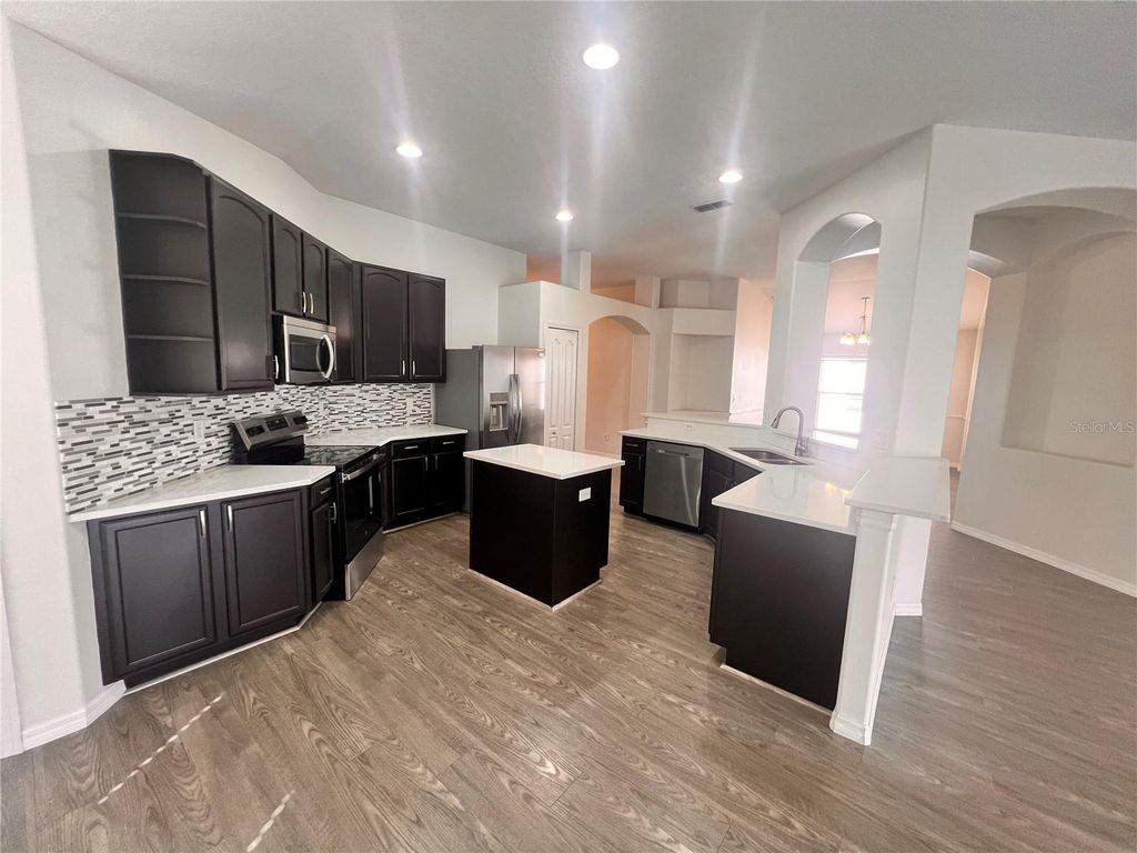 Photo of 3930 Lakeside Reserve Lane, Orlando, FL 32810 (MLS # O6388015)