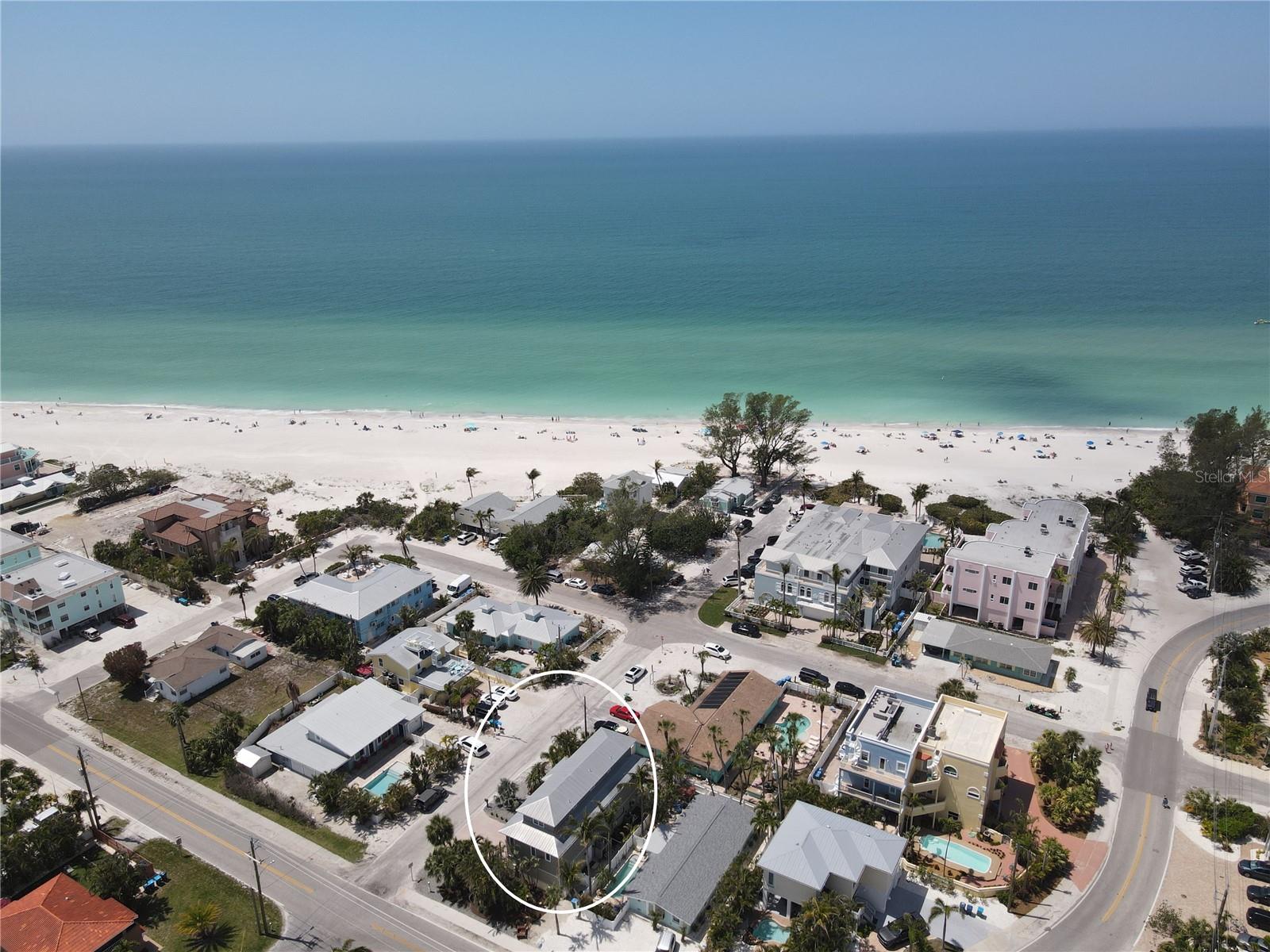The Ultimate Gulfside Retreat on Holmes Beach, Anna Maria Island!
NO WATER INTRUSION IN MAIN LIVING AREAS FROM RECENT HURRICANES and NO HOA! Just 200 feet from the sugar-sand shores and turquoise waters of the Gulf of Mexico, this updated, coastal-inspired three-level beach home with a private elevator offers the perfect blend of luxury, comfort, and investment potential.
With over 2,000 sq. ft. of bright, open living space, 3 bedrooms, 3.5 baths, a private pool and hot tub, and sweeping Gulf views from your balcony, this is truly the ultimate island escape. Currently a high-performing vacation rental generating over $120,000 annually with future bookings in place, this property also makes an ideal primary residence or second home. Offered fully furnished—including sleeper sofas—it’s ready to comfortably accommodate family, friends, and guests.
The main level boasts a light-filled open-concept living area with large windows and sliding glass doors overlooking lush tropical landscaping. The chef’s kitchen features newer stainless-steel appliances, dual refrigerators, expansive granite counters, a wine cooler, and walk-in pantry. Entertaining is effortless with a breakfast bar, indoor dining space, and outdoor dining options. The primary suite on this level is a private retreat with dual walk-in closets and a spa-style ensuite bath featuring both a shower/tub combo and a separate walk-in shower, plus a water closet with bidet.
Take the private elevator to the upper level where you’ll find a second primary bedroom with ensuite bath and walk-in closet, a third spacious bedroom, an additional full bath, and a laundry room.
The ground floor welcomes you with a large foyer and a versatile flex space—perfect for storage, crafts, or a media room—along with access to the oversized 2-car garage. Additional upgrades include a reverse osmosis system and three newer air conditioners for consistent comfort throughout the home.
Step outside to your private, fenced outdoor oasis, complete with sparkling pool, bubbling hot tub, and plenty of seating for lounging or alfresco dining while enjoying the Gulf breezes and breathtaking sunsets.
Perfectly situated less than 2 miles from the vibrant shops and restaurants of Bradenton Beach—and just steps from the Gulf—this rare property combines island living at its best with proven rental income.
Schedule your private showing today—your Anna Maria Island paradise awaits!