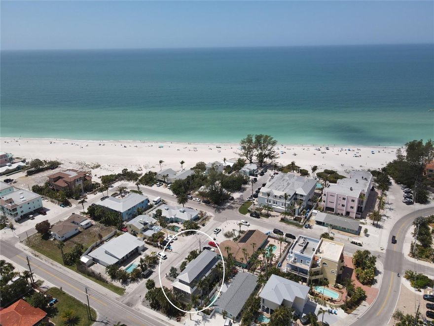 The Ultimate Gulfside Retreat on Holmes Beach, Anna Maria Island!

NO WATER INTRUSION IN MAIN LIVING AREAS FROM RECENT HURRICANES and NO HOA! Just 200 feet from the sugar-sand shores and turquoise waters of the Gulf of Mexico, this updated, coastal-inspired three-level beach home with a private elevator offers the perfect blend of luxury, comfort, and investment potential.

With over 2,000 sq. ft. of bright, open living space, 3 bedrooms, 3.5 baths, a private pool and hot tub, and sweeping Gulf views from your balcony, this is truly the ultimate island escape. Currently a high-performing vacation rental generating over $120,000 annually with future bookings in place, this property also makes an ideal primary residence or second home. Offered fully furnished—including sleeper sofas—it’s ready to comfortably accommodate family, friends, and guests.

The main level boasts a light-filled open-concept living area with large windows and sliding glass doors overlooking lush tropical landscaping. The chef’s kitchen features newer stainless-steel appliances, dual refrigerators, expansive granite counters, a wine cooler, and walk-in pantry. Entertaining is effortless with a breakfast bar, indoor dining space, and outdoor dining options. The primary suite on this level is a private retreat with dual walk-in closets and a spa-style ensuite bath featuring both a shower/tub combo and a separate walk-in shower, plus a water closet with bidet.

Take the private elevator to the upper level where you’ll find a second primary bedroom with ensuite bath and walk-in closet, a third spacious bedroom, an additional full bath, and a laundry room.

The ground floor welcomes you with a large foyer and a versatile flex space—perfect for storage, crafts, or a media room—along with access to the oversized 2-car garage. Additional upgrades include a reverse osmosis system and three newer air conditioners for consistent comfort throughout the home.

Step outside to your private, fenced outdoor oasis, complete with sparkling pool, bubbling hot tub, and plenty of seating for lounging or alfresco dining while enjoying the Gulf breezes and breathtaking sunsets.

Perfectly situated at Holmes Beach with its vibrant shops, restaurants and beaches, and less than 2 miles from the shops beaches and restaurants of Bradenton Beach—and just steps from the Gulf.  Longboat Key, Sarasota, Siesta Key and SRQ Airport are also close by.  This rare property combines island living at its best with proven rental income.

Schedule your private showing today—your Anna Maria Island paradise awaits!