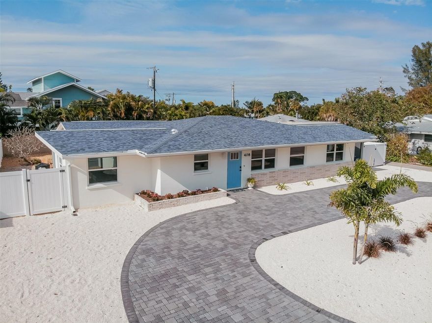Welcome to paradise at Coco Cay! This beautiful 4 bedroom 4 bathroom home has been completely remodeled top to bottom. Brand new hurricane impact windows and doors, a new roof, kitchen, appliances, bathrooms, flooring, paint, furnishings, and even a new pool! This island oasis is move-in ready and only a few blocks from the world-famous beaches of Anna Maria Island. You will notice coastal décor as soon as you step into this island gem. The home provides a spacious open living area with teal accents, stainless-steel appliances, quartz countertops, and a game room conveniently adjacent to the kitchen with a pool table and dartboard. Outside you'll enjoy a screened in porch accessible from the living room, a seating area complete with a firepit, and a huge covered lanai for cooking and dining poolside. Weekly rentals are allowed. Make an appointment for your private showing and see what makes Coco Cay an excellent full-time home or investment property.