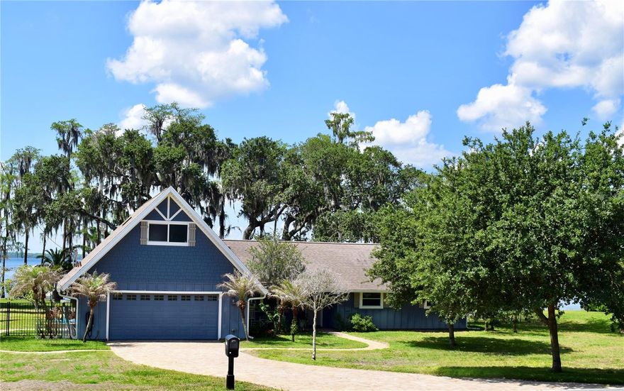 Experience true lakefront living on the Clermont Chain of Lakes with this beautifully fully updated home on the shores of Lake Louisa. Situated on over ½ acre with approximately 116 feet of direct lake frontage, this property offers breathtaking wide-water views, a private dock, unforgettable sunsets and the ultimate Florida waterfront lifestyle.
The heart of the home is a stunning open-concept kitchen and living space, completely renovated with high-end finishes, custom cabinetry and an oversized island - all flowing seamlessly toward expansive windows the frame the lake beyond.  The spacious layout includes 4 bedrooms and 3 full bathrooms, highlighted by two primary suites - one on each level - providing ideal flexibility for guests, extended family, or a private upstairs retreat with dramatic windows overlooking the water.

Step outside and the property truly shines. The expansive backyard opens to sweeping lake views and direct access to one of Central Florida’s most sought-after boating chains. A private screened-in dock and boathouse with lift make it easy to enjoy boating, fishing, and water sports right from your backyard. Recent improvements including a new dock and seawall (2022–2023) enhance both the beauty and longevity of the waterfront.

With its complete interior remodel, prime Lake Louisa frontage, and exceptional outdoor living, this property presents a rare opportunity to enjoy refined lakefront living in one of Clermont’s most sought-after settings—just minutes from downtown and a short drive to Orlando’s premier destinations.