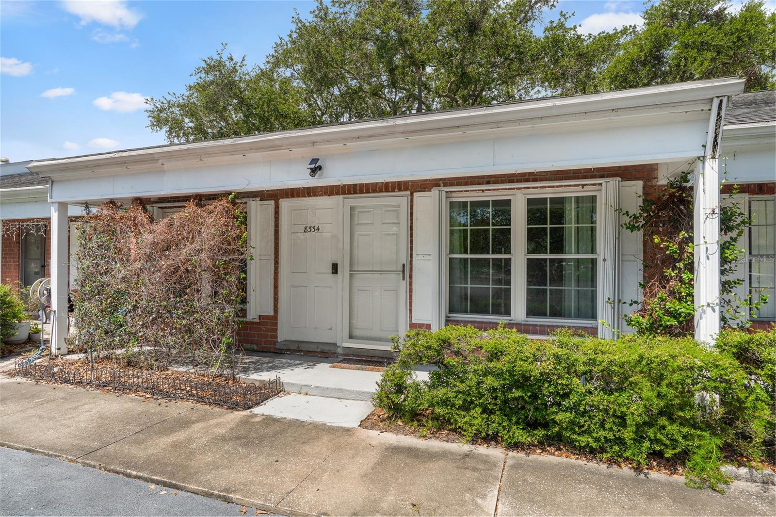 One or more photo(s) has been virtually staged. Attention investors, and anyone seeking a centrally located place to call home with a LOW MO/HOA in sunny St. Petersburg (cash/private financing only). Welcome to your slice of paradise, with assigned/guest parking directly in front, and a community pool to cool off in close to the villa. This blank canvas offers a large split, two-bedroom floor plan with endless potential. A built-in office/laundry area, with access to the rear patio, is also located directly off the back. The kitchen includes stainless steel appliances, granite countertops, and light oak cabinets, with AMPLE storage. The unit has been updated with ceramic tile floors throughout, double-pane windows, and a new slider door for quiet and energy efficiency. HVAC (air conditioning) 2020, Electrical Panel 2011. Schedule your showing today before this villa vanishes from the market!
