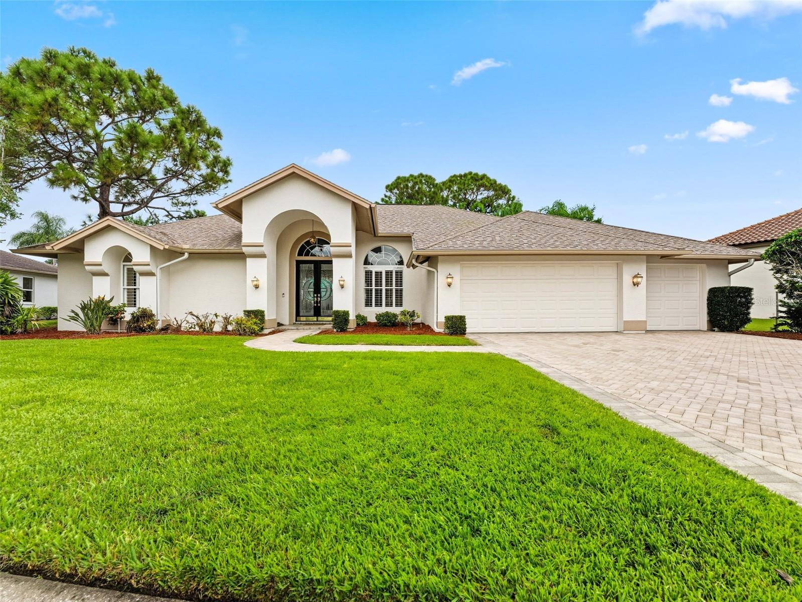 Stunning & newly RENOVATED Arthur Rutenberg home in Prestwick Village at The Eagles. Welcome to this beautifully updated single-story Arthur Rutenberg home in the highly desirable Prestwick Village of The Eagles. Featuring 4 bedrooms, 3 bathrooms, a 3-car garage, and a private pool, this residence combines elegance, comfort, and privacy on an oversized lot with serene pond views. Inside, you’ll find soaring 12-foot ceilings, an inviting open floor plan, and stunning views of the screened-in pool and lanai from the moment you enter. The formal dining and living rooms frame the entryway, while the spacious kitchen with granite countertops, breakfast nook, and family room make entertaining and everyday living seamless. The popular split layout includes a large primary suite with pool access, dual vanities, walk-in shower, garden tub, and oversized closet. Two bedrooms share a full bath near the kitchen, while the fourth bedroom is tucked away with its own bath that doubles as a pool bath—ideal for guests. This home has been extensively renovated with new tile and luxury vinyl plank flooring throughout, three fully updated bathrooms, freshly painted kitchen cabinets, new hardware, interior paint, custom closets, and plantation shutters. Additional improvements include new appliances, updated lighting and ceiling fans, sliding glass doors serviced for smooth operation, refreshed landscaping with improved pond views, and even a new dog run side fence. Recent big-ticket updates include a newer roof and AC (2018) for peace of mind. The Eagles is a premier gated golf community offering 24/7 manned security, two championship golf courses, clubhouse with restaurant, tennis and pickleball, basketball courts, playgrounds, and year-round neighborhood events—all with low HOA fees and no CDD. Zoned for top-rated schools and located just minutes from shopping, dining, Tampa International Airport, and the Gulf beaches, this beautiful home offers both lifestyle and convenience.