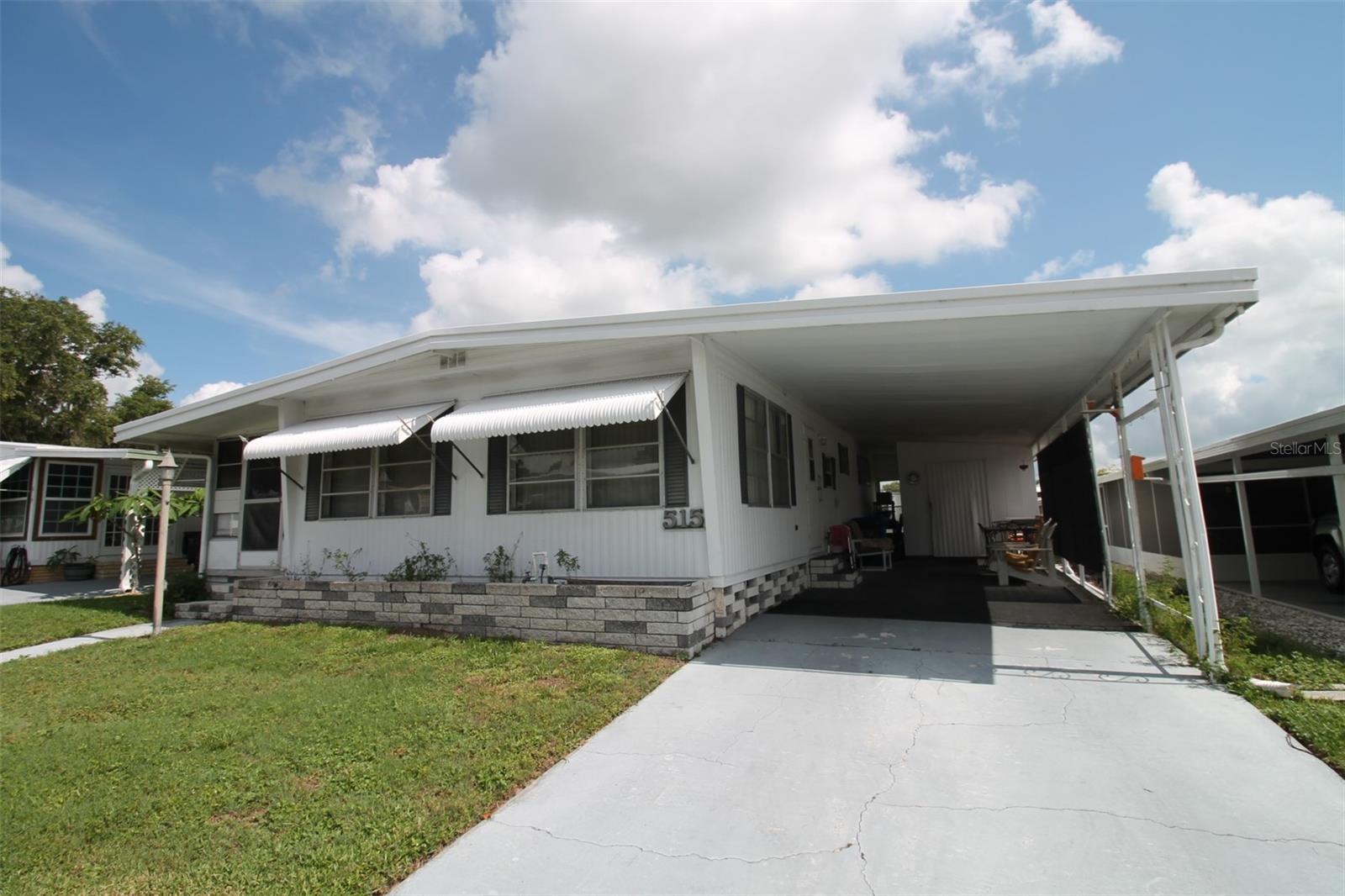 Cash Only!! This 2 bedroom/2bathroom mobile home offers a spacious living room, Florida Room, and plenty of potential to update and turn this into your cozy home in the wonderful Lakeside Hills Estates. Great 55+ community with multiple amenities including a clubhouse, gazebo, heated pool, hot tub and more. The clubhouse offers a library, kitchen, gym, game room, lounge, craft room, workshop, shuffleboard, and meeting rooms. The active community hosts pool parties, karaoke, and more activities. Located close to shopping, dining and entertainment. The community also has access to a lake with a marina and fishing pier! In addition to this- cable, water and lawn maintenance are included in the low HOA fee with NO lot rent.