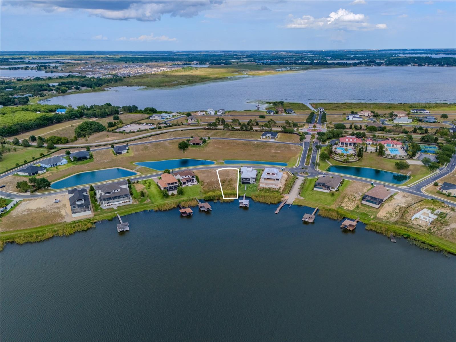 Waterfront Paradise on Lake Van – Build Your Dream Home! Discover the perfect waterfront lot with breathtaking open views and direct access to Lake Van, offering endless water activities such as jet skiing, boating, water skiing, kayaking, and more. This exceptional homesite provides a unique opportunity to create your custom dream home in one of Central Florida’s most prestigious communities.
Located in the highly sought-after gated community of Water Ridge, this property grants you access to resort-style amenities, including, Three luxurious swimming pools,Elegant clubhouse with social spaces, State-of-the-art fitness center & sauna, Two private boat ramps for easy lake access, Lighted tennis courts & pickle ball courts, Basketball courts for active recreation, Boat and RV storage for added convenience and Fishing pier to enjoy peaceful lake moments. Choose from a list of preferred builders or bring your own builder to design the home you’ve always envisioned. With endless possibilities, this lot is a rare find for those seeking a serene yet vibrant waterfront lifestyle.
Don’t miss out on this extraordinary opportunity.
