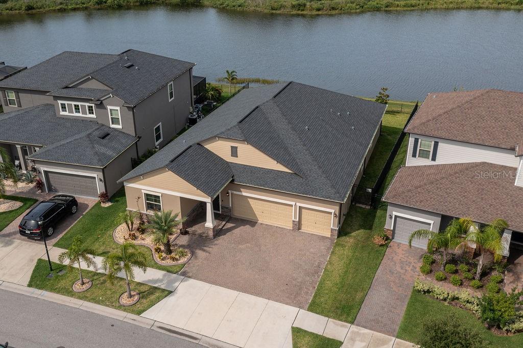 Back on the market, due to buyer's lending. This remarkable home is available for immediate move-in and is sure to impress. With four bedrooms and three bathrooms, the open floor plan is ideal for hosting gatherings and entertaining guests. The property was built in 2019, ensuring that the roof, air conditioning, and appliances are all less than five years old. Featuring several upgrades, including a fenced-in yard, an Osmosis Water softener system, an induction stove top, and a Ruckus WIFI Access point for optimal internet coverage, this home has it all. The master bedroom and living spaces have been enhanced with crown molding, adding a touch of luxury and elegance to the overall ambiance.
Enjoy stunning views of a tranquil lake from the property, with no neighbors at the back, providing a breathtaking sunset view every evening. Community amenities such as a swimming pool, tennis court, and basketball court are easily accessible from the property. Don't miss out on this incredible opportunity and schedule a showing today!