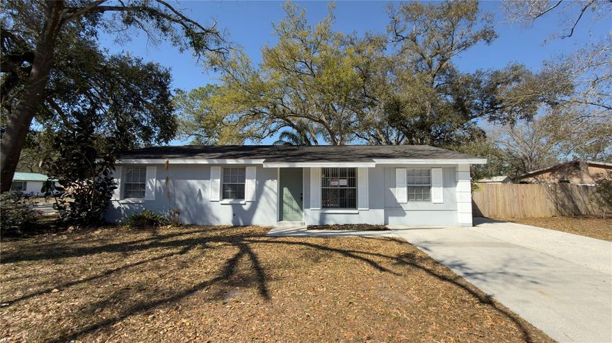 Welcome home to your 4 bedroom/2 bath home on a corner fenced lot! This concrete block has so much to enjoy inside and out. It has brand new luxury vinyl plank flooring throughout and it has been freshly painted.  The Galley Kitchen features granite counter tops, new cabinets, stainless appliances, and updated fixtures and lighting. Enjoy a backyard view in the designated Dining Area, adjacent to both the Kitchen and Living Room. Split floor plan features 3 bedrooms and a bath with granite vanity counter and shower/tub combo on one side of the home and the Primary suite on the other. The Primary Bath has a double granite counter vanity, with new cabinets, fixtures and walk-in shower. Ready to go outside? Ample room for fun on the back patio and room for cooking, playing and socializing. Extra feature is the fence includes an additional entry gate off of Sugarcreek Dr. Close to parks, major thoroughfares and shopping.