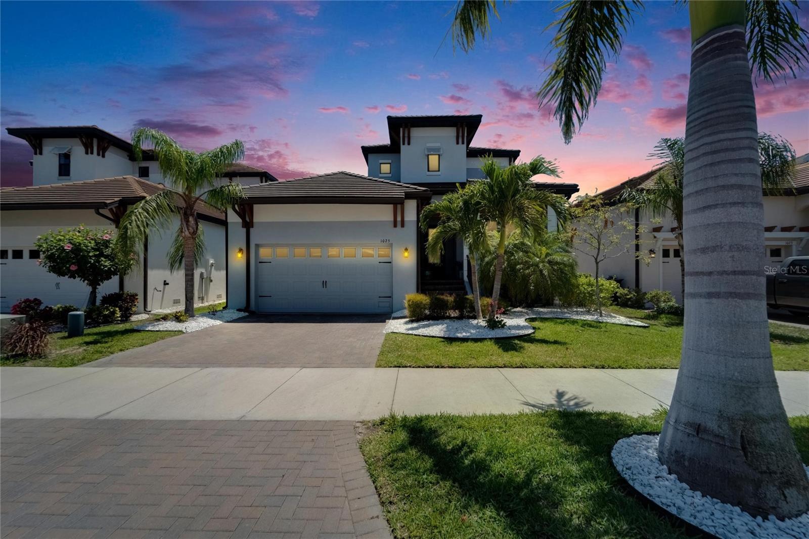 Experience the Pinnacle of Waterfront Luxury at SouthShore Yacht Club
Nestled in the charming coastal city of Ruskin, FL, SouthShore Yacht Club stands as a premier, master-planned community offering an unparalleled waterfront lifestyle. Among the most distinguished offerings is the stunning Anna Maria floor plan — an extraordinary blend of design, comfort, and luxury.
This exceptional two-story home spans 2,600 square feet of elegantly crafted living space, with 3 bedrooms and 2.5 bathrooms. No detail has been overlooked, from the exquisite 8" crown molding to the soaring 22-foot foyer ceiling. A sophisticated office space welcomes you upon entry, with custom glasswork adding a touch of refined elegance.
The spacious great room flows seamlessly through triple sliding glass doors to a vast, screened-in patio — the ideal setting for entertaining or simply relaxing while enjoying breathtaking outdoor views. The patio, complete with summer kitchen features, overlooks a serene conservation area, ensuring privacy and a peaceful, natural ambiance.
Located on the main floor, the master suite serves as a private retreat. It boasts an opulent en-suite bathroom and an expansive walk-in closet, creating a true sanctuary within the home. Upstairs, two additional bedrooms and a versatile loft await — perfect for guests, a media room, or a cozy lounge area.
The heart of the home, the chef’s kitchen, is a work of art. Featuring 42" Sierra Vista painted linen cabinetry, custom crown molding, and satin nickel hardware, it offers both beauty and function. Calcutta Gold polished quartz countertops complement the sleek design, while GE Profile stainless-steel appliances and Esplanade Hall ceramic tiles laid in a 70/30 offset pattern complete the space with timeless sophistication.
Beyond the home, SouthShore Yacht Club offers an unparalleled resort-style lifestyle. Enjoy waterfront dining, a full-service marina with wet slips, dry storage, and a tackle shop, with easy access to Tampa Bay’s vibrant waterways. A state-of-the-art fitness center, pickleball courts, a luxurious clubhouse, and a sparkling community pool are just the beginning. There’s even a dog park for your furry friends, ensuring every member of the family is catered to.
At SouthShore Yacht Club, luxury living isn’t a dream — it’s a daily reality. Embrace the lifestyle you’ve always imagined, where sophistication and tranquility blend seamlessly with nature and modern amenities.