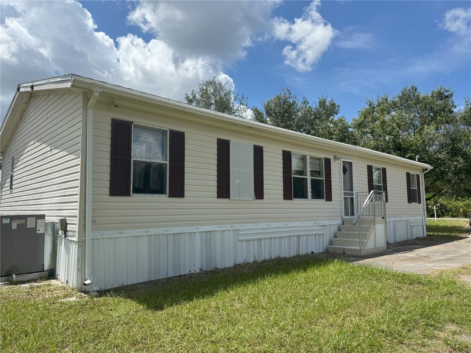 NO MONEY DOWN FINANCING AVAILABLE TO QUALIFIED BUYERS! A quiet oasis is what you will find in this 3 bedroom 2 bath 2 car garage home in eastern Punta Gorda. This split bedroom floor plan begins with a large Primary bedroom that leads to a spacious living room and eat in kitchen. A Family room big enough for a large play room or even a pool table! The backyard is where you will find a separate garage and workshop, big enough to hold all of your tools. This home sits on just over 1/2 acre in a very quiet area of Charlotte Highlands subdivision. This property qualifies for USDA mortgage financing with no money down to qualified buyers. Make an appointment today to see this lovely home, you'll be glad that you did!