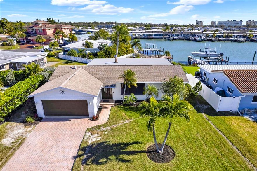 FABULOUS WATERFRONT POOL HOME IN HIGHLY DESIRABLE OAKHURST SHORES! Welcome to this
beautifully renovated 3-bedroom, 2-bath block home offering 1,782 sq ft of living space in one of
Seminole’s most sought-after waterfront communities—just 2.5 miles from the beach! Situated in the
established, elevated Oakhurst Shores neighborhood, this home has been fully renovated post-storm
and offers an ideal split floor plan. Features include a spacious family room with wood-burning fireplace,
an updated kitchen with new cabinetry, quartz countertops, stylish backsplash, recessed lighting, and
new appliances, plus a formal living/dining area. The primary suite boasts a fully updated en-suite bath
with walk-in shower and dual-sink vanity. Two additional bedrooms—one with patio access—share a full
hall bath, perfect for family or guests. Enjoy true Florida living outdoors with a sparkling pool, serene
water views, and a newer private dock with updated seawall and the ability to add a boat lift if desired.
Additional highlights include a NEWER ROOF (2017), HVAC (2021), long paver driveway, beautiful
landscaping, fresh interior and exterior paint, brand-new irrigation system, all new lighting, and new
pool tile. Conveniently located near Seminole City Center, top-rated schools, parks, golf, medical
facilities, shopping, dining, entertainment, and a short drive to Tampa International Airport. Don’t miss
this exceptional waterfront opportunity—schedule your private showing today!