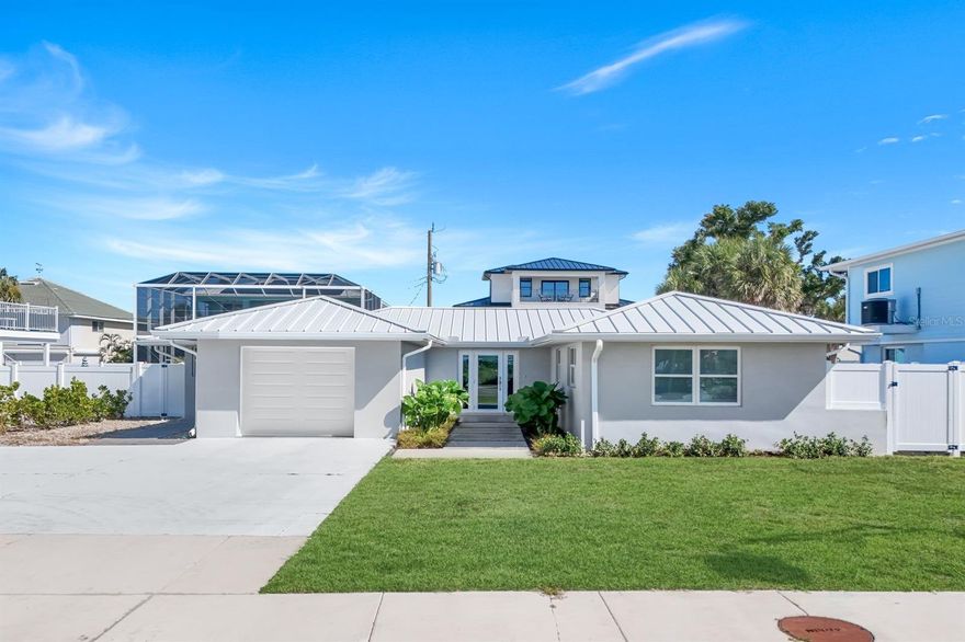 Your Paradise Awaits: Prime Investment Opportunity on Fort Myers Beach Welcome to the South End of Fort Myers Beach, where a rare opportunity awaits in a coveted weekly rental zone. This stunning, updated 3-bedroom, 2.5-bathroom home is your ticket to a luxurious Florida lifestyle or a high-demand investment property. Spanning 2,396 sq. ft., this residence has been meticulously updated throughout and feels practically like new. The home was completely renovated in 2023. Step inside to find a chef's dream kitchen featuring granite countertops and stainless steel appliances. Furnishings are negotiable, making for an effortless, turn-key transition. For the ultimate peace of mind and long-term value, the property features a metal roof with a life expectancy of 50+ years. Location, Location, Location! Enjoy the ultimate beach lifestyle! Located just across the street from the Gulf of Mexico, you're only a short stroll to the white sugar-sand beaches. The property sits on nearly a quarter of an acre, with room for a pool to create your private backyard oasis. This incredible location puts you at the heart of the action, close to the area's most exciting destinations, including: The newly opened Jimmy Buffett’s Margaritaville Resort Santini Plaza, CVS and Publix The newly developed downtown entertainment and dining district Whether you're in the mood for live music, fine dining, or boutique shopping, it's all just minutes away. This property truly offers something for everyone—boating, fishing, entertaining, or simply soaking in the stunning views. This is a rare chance to own in one of Southwest Florida's most desirable areas. Don't miss out on this spectacular home and investment!