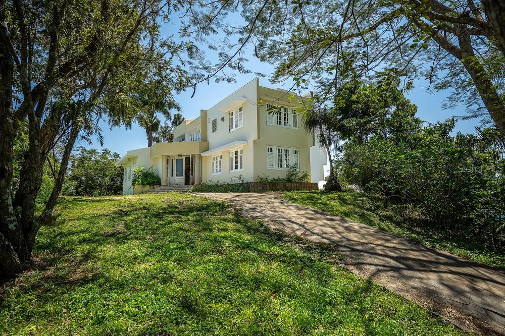 ? NEW LISTING ALERT!!!!
Aguas Buenas, Puerto Rico
On the TOP of a hill, surrounded by the greenery of the MOUNTAINS stands this multi-level residence in the charming town of Aguas Buenas, Puerto Rico. Situated on a 5-acre farm, this property offers great EXCLUSIVITY for those families who value privacy and crave a lifestyle connected to nature and farm life.
Distributed in 3 levels, the property offers over 3,500 p/c where you will find 4 bedrooms / 3 full bathrooms / 2 half bathrooms, foyer, family room, living room, kitchen, outdoor terrace, covered terrace, office and warehouse an architecture that combines elegance and functionality, the residence offers ample spaces designed for the comfort and convenience of its residents. The multiple levels allow you to enjoy unparalleled panoramic views from every corner, while the spacious terraces invite you to contemplate all the natural beauty that surrounds it.
The large windows are part of the architectural design allowing natural light to flood the rooms, creating a fresh, bright and welcoming atmosphere at all times.
The natural environment surrounding the property offers a spectacle for those seeking a deeper connection with nature. The gardens, trails and cultivated areas provide great tranquility where one can enjoy serenity away from the hustle and bustle of the city.
In short, this residence in Aguas Buenas is much more than just a house: it is a private retreat where families can find peace, connection with nature and an unparalleled quality of life. It is the ideal place for those looking to escape the hustle and bustle of the city and find true country life in Puerto Rico.