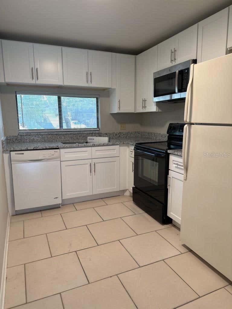 Photo of 11411 Midfield Way, Tampa, FL 33624 (MLS # TB8540510)