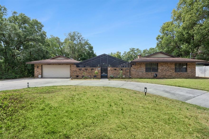 Rare opportunity in Fruitland Park! Pool home with detached guest suite/in-law quarters. This well-maintained property features a 4-bedroom, 2-bath main residence (just under 1,700 sq ft) plus a separate 1-bedroom, 1-bath guest unit of approximately 800 sq ft—ideal for multi-generational living or potential rental income. The main home offers a functional layout with a front family/game room, spacious kitchen, and an open living area with a gas fireplace. The primary suite provides a comfortable retreat, while sliding glass doors bring in natural light and lead to the screened-in pool area. Enjoy Florida living outdoors with a private pool, expansive screened enclosure, outdoor shower, and sauna—perfect for relaxing or entertaining. The detached guest suite is located adjacent to the pool area and offers its own living space, kitchen, bedroom, and bath. Pool home | Guest house/in-law suite | Screened enclosure | Sauna Conveniently located near shopping, dining, and major roadways. Schedule your showing today—this unique property won’t last long.