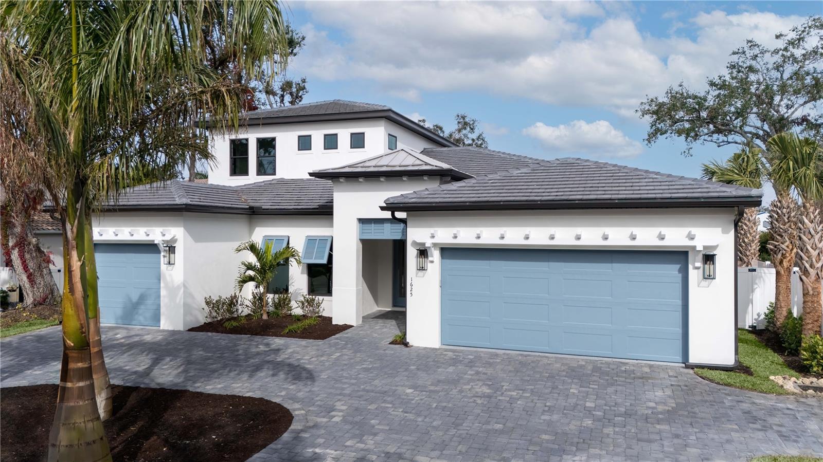 *Ready For Move-In*The Bahama by Heritage Builders is truly a masterpiece of Florida luxury living, expertly combining everything to be desired in a custom home. This spacious 4 Bedroom, 4-1/2 Bathroom dream home also delivers both a Bonus Room and a Private Study. The home’s elevation blends a tropical island aesthetic with classic architectural features including planation window coverings and a beautiful roof line complete with custom trellis accents. Grand, double doors lead into the home which opens to a large, bright Foyer. Once inside, the Bahama showcases an open layout, with the Great Room and Kitchen taking center stage. The immense Great Room is highlighted by a gorgeous, tented ceiling that is a Heritage Builders signature feature. The designer Kitchen is accessible to the Great Room providing an elegant yet relaxed atmosphere, while the Dining room is separated should a more formal setting be desired for entertaining. The Bahama Great Room features standout 12-foot wall of sliding glass doors that disappear to seamlessly blend the inside with the outside. The spacious covered Lanai ample seating space and a built-in outdoor kitchen overlooking the beautifully designed pool and spa.
The Owner’s Suite offers dual walk-in closets, double vanities and elegant shower with frameless glass enclosure. Opposite the Master Suite lies a first-floor secondary ensuite guest bedroom, along with a dedicated Study.
The Bahama’s second level offers two additional secondary bedrooms, two bathrooms, and a generous Bonus Room.
A tasteful mix of porcelain tile and plush carpeting are throughout the home. Custom hardwood cabinets with quartz and granite counter tops throughout the residence provide stylish and timeless kitchen and bathrooms. Hurricane, impact rated, insulated, Low E windows with vinyl frames are included throughout the home. Spray foam insulation, and 8' solid core doors are also included.