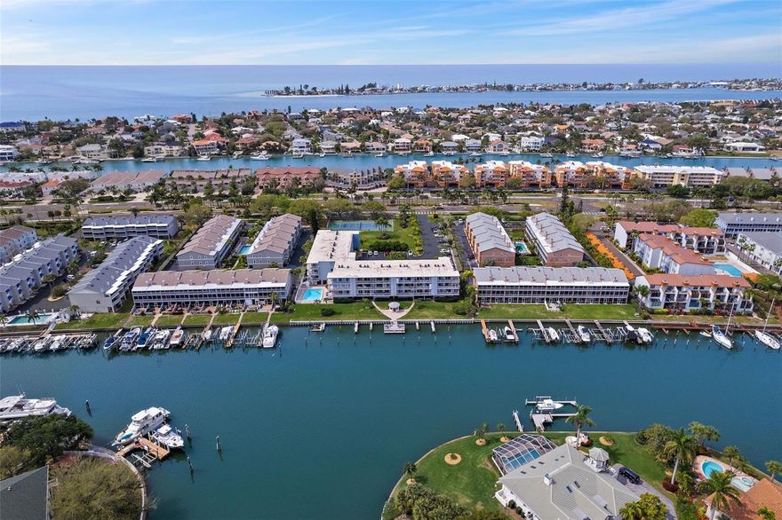 Who wouldn't want to live the island life?  Tierra Verde is known for it's active lifestyle and enjoying the salt life.  From this luxurious island you are sure to find every way possible to cherish the outdoors and fresh air.  It's home to picturesque vistas, lush greenspace and bike lanes popular with cycling enthusiasts. Many of the homes and condominiums on the island are $1M or more - some much more. All roads lead to the world renown Ft. Desoto park - rated one of the US's best parks and beaches year after year. Enjoy fishing, boating, kayaking, bird and dolphin sightings. The Tierra I community offers a beautiful waterfront with a fishing dock, gazebo and boat access and dock rentals as well as tennis and pickleball courts, swimming pool a fitness center and even a car wash. Although the building accommodates the active homeowner, there is also an elevator which some condominiums do not have and the maintenance fees are some of the lowest on the island. The residence is beautifully done with gorgeous custom finishes. The bedrooms are spacious and the primary provides access through sliding doors to the huge wrap around balcony featuring perfect sunset views every evening. The kitchen was done by it's designer owner, the floors are tile not the thinner LVP like in so many places. Bathrooms and kitchen are updated, and the doors and windows are new and full impact glass. There is both reserved parking for residents and ample guest parking. Don't miss your chance to live on Tierra Verde for this price. No issues from impact studies or hurricanes and no special assessments pended or needed.  The island also host many of the areas most popular restaurants for some great waterfront dining and live music.  Come call Tierra Verde home!