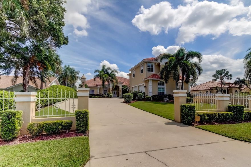 Sunrise to Sunset get on your boat head out on the deep water canal just  a few minutes boat ride to the open waters of Tampa Bay. This spectacular 5 bedroom, 4.5 bath, 4,337 s/f waterfront home with oversized 3 car garage, incredible bonus room and office sits on over a half acre and is waiting for the most discerning buyer. Quality upgrades with meticulous attention to detail and the highest quality craftsmanship add style and elegance throughout. As you enter the foyer you notice the spacious office w/custom cabinetry and plenty of workspace on your left and the elegant dining room on your right complete with plantation shutters & new lighting. The kitchen features stainless steel appliances, built-in double oven, expansive granite counters, breakfast bar, built-in coffee station and butler's pantry, custom Craft Maid maple cabinetry w/crown molding, pull out's, ample storage, soft close drawers and over & under cabinet lighting. The huge family room is nicely equipped with gas fireplace, beautiful mantel, surround sound, breakfast nook with large windows that allows for a lot of natural light all while overlooking the sparkling pool. The enormous Master suite is the perfect place to start and end the day with two walk-in closets, high ceilings, large windows and plenty of room for larger furniture. The master bath features a complete spa experience, sunken jacuzzi tub, walk-in seamless shower, dual granite vanities w/upgraded wood cabinets & fixtures. Beside the office is bedroom 2 which also could be used as a workout room. The Guest suite is nicely appointed with walk-in closet, ensuite bath w/marble counter, and new enclosed shower. Bedrooms 4 & 5  have walk in closets split with a jack & jill bathroom with granite counter & wood cabinets. Upstairs is the Bonus Room/Media Room/Man Cave where you will be the envy of friends & family with over 1000 square feet of pure laid back fun featuring upgraded granite bar, custom natural stacked rock backsplash, frig, microwave, engineered distressed birch hardwood floors, hurricane impact windows, plantation shutters, intercom, attic storage, half bath w/granite. Outside enjoy the huge private back yard and over 80 feet of canal frontage with room for a large boat & jet skis to enjoy fishing and all that waterfront living has to offer on your very own composite deck w/ 13,000 lb boat lift and a floating jet ski dock. It will be hard to leave the screened private 8 feet deep sparkling saltwater pool and spa with custom sunken swim up bar. Some of the other features include oversized 3 car garage w/additional storage & workshop, mud room w/ custom cabinets, plant shelves, recessed lighting throughout, washer & dryer, sink & cabinets in laundry room, security system, bug misting system surrounds pool area & front entrance, termite warranty, 125 gallon propane tank, lush landscaping w/custom lighting, high ceilings, 2 water heaters, sprinkler system, covered & screened lanai. This highly sought-after, exclusive hidden gem is conveniently located near the best public and private schools, golfing, fabulous shopping, top restaurants, Suncoast Trail, Downtown Tampa and both Tampa International Airport and the Westshore Business District. Just 30 minutes to the best beaches in America...NOTE; All furniture & furnishings to include built in office furniture, pool table in man cave and outdoor grill available for purchase.