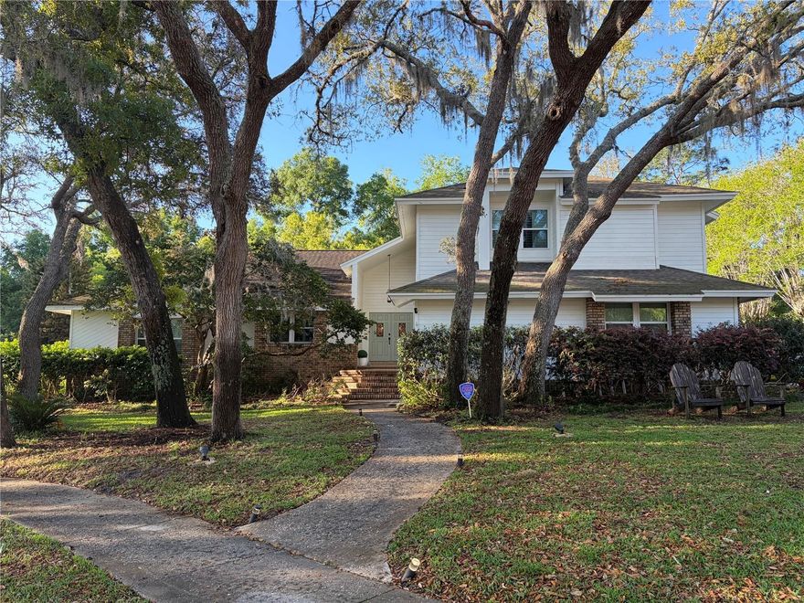 Come see this beautiful over 3500 square foot split level 5 bedroom, 3 bathroom Contemporary home in desirable Sweetwater Oaks community. The home features an open concept kitchen and family room combination with vaulted ceilings, granite countertops, island with sink, dishwasher, two level countertop, and eat-in kitchen breakfast nook. The family/great room features a custom stone fireplace with built-in shelving. It opens up to the screened pool area with three panel sliding glass pocket doors that slide into wall creating a larger opening. The living room and dining room open concept combination features vaulted ceilings, sliding glass door, multiple windows with a view overlooking the screened in pool. Three bedrooms with a loft and bathroom located on the second floor. Smart outdoor controlled lighting installed for security, special events, or holidays. Enjoy the outdoors in this beautiful tree lined neighborhood community with private lake access, boat dock, basketball court, playground, beach volleyball, and tennis courts.