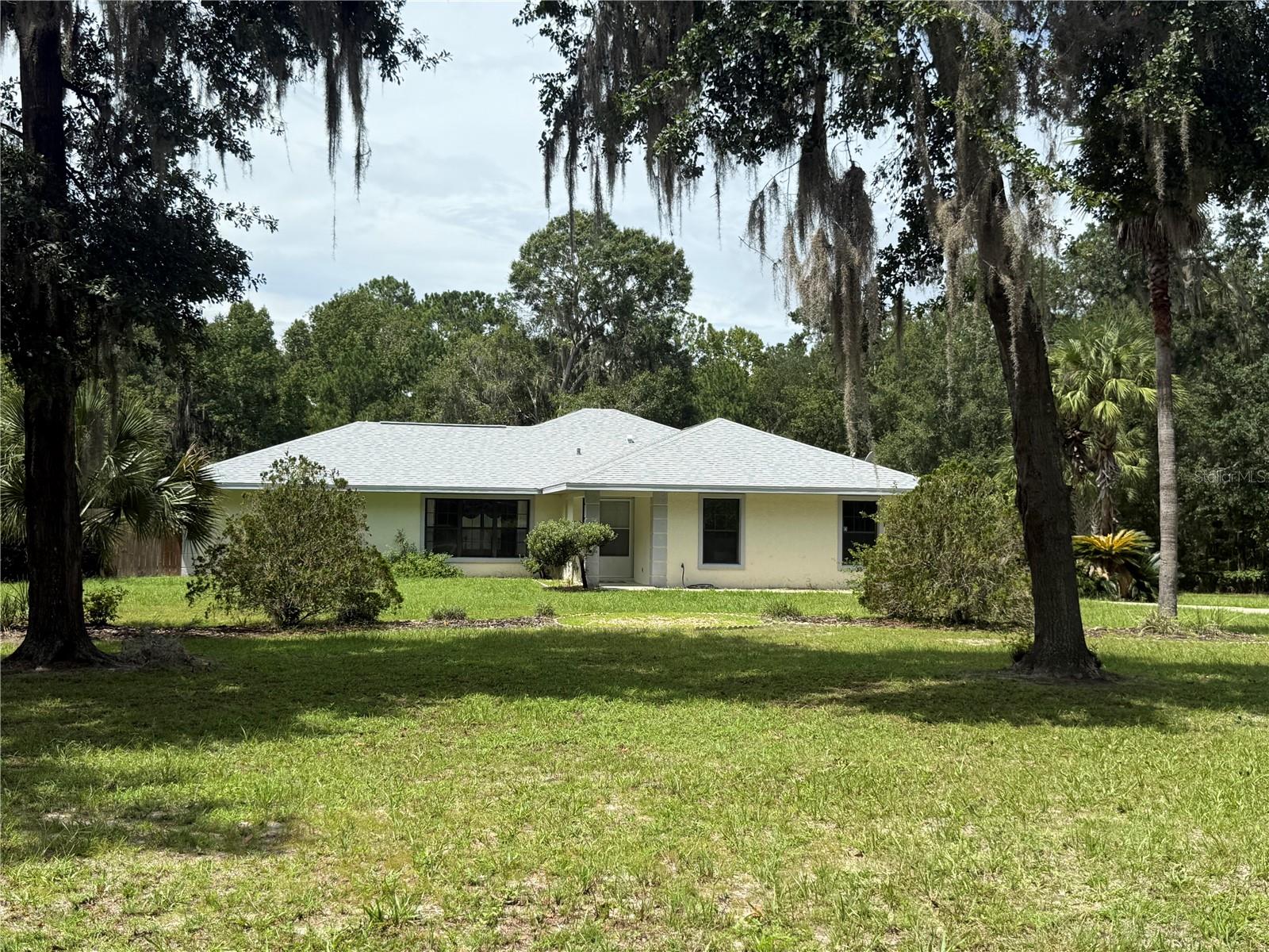 3 Acre Mini Farm in the Coveted "Saddle Hill" Equestrian community of NW Marion County. The solid C/B Pool home is a 3 Bedroom, 2 Bath split plan. The Primary suite is generous with sliders to the Pool and a big Walk In Closet. With 2 Living areas there is plenty of room for a big family or those that prefer quiet to chaos. The dining room is open to the Living , Family and Kitchen. The Kitchen has granite counters and Maple Cabs along with a Pantry. Inside Laundry. The Screened Pool area offers a covered Lanai with access from the Family room and Primary Bedroom. There is a 2 Stall (12X12) Barn attached to an Air Conditioned Dog Kennel with its own private entrance off the road. The lush Horse pasture is safely fenced with No Climb Wire and Top Board. Spectrum Internet service offers High Speed Internet for those who work from home. This property is located a couple miles from I-75, offering easy access to Gainesville or Ocala within 20 minutes. Roof 2024, Water Heater 2025.