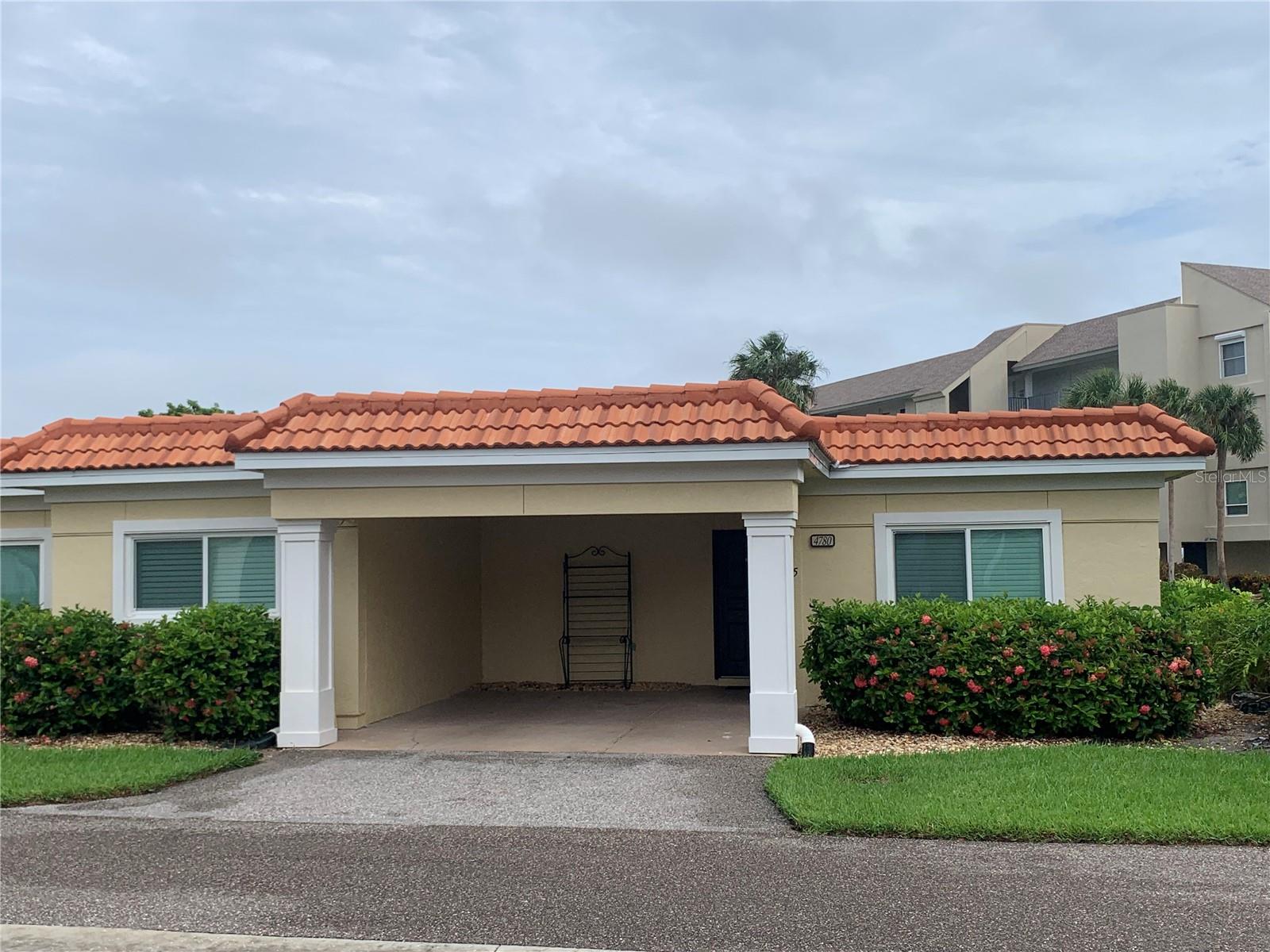 This immaculate 2-bedroom, 2-bath ground-floor villa located in the highly sought-out community of Windward Bay has peek-a-boo views of the Gulf. Turnkey furnished with one carport at your front door. The community of Windward Bay is pristine. There is private deeded beach access just across the street, two public beach access, two marinas BBQ grills, 1/2 mile of walking trails, two heated pools, lighted tennis courts, pickleball court, fitness center, locker rooms, saunas, shuffleboard, bike racks, clubhouse with kitchen, lending library, and covered parking. Guests enjoy 3 access points to the gulf with one being private deeded access!