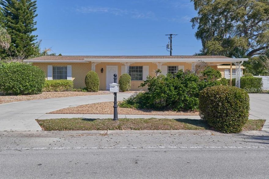 Location, convenience, and charm! This delightful 2-bedroom, 2-bath home is ideally situated just two blocks from the shops and restaurants of the sought-after Gulf Gate community. Enjoy an open floor plan that flows seamlessly to a lovely screened-in pool area—perfect for relaxing or entertaining. The fully fenced yard offers plenty of space for pets to run and play. Features include terrazzo floors throughout, a circular driveway, and a freshly painted exterior.  A wonderful opportunity to enjoy the Gulf Gate Lifestyle.   Exterior of home is currently being painted.  Professional pictures next week.