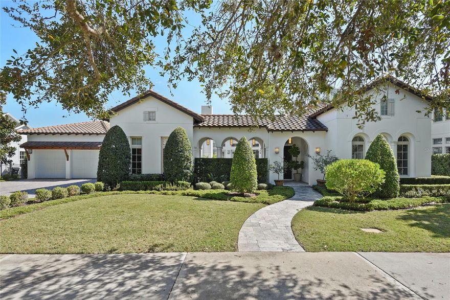 Exquisite Waterview Home in Baldwin Park. Customized to pure-perfection, this stunning four-bedroom, 4 full baths, 2 -half-baths, single-story pool home defines luxury. As you enter the home through the hacienda-inspired courtyard, you’ll take immediate notice of the amazing level of craftsmanship and attention to detail. Features such as wood floors, 12' elevated ceilings, radius windows, beautifully detailed moldings, and custom RH window treatments and decor compliment the home’s interior throughout. The gourmet kitchen is located at the heart of the home and features GE Monogram appliances, a gas cooktop and range, double dishwashers, a pot filler, Quartz countertops, a dolomite backsplash and an incredible island with a single-slab piece of imported Bianca Rhino marble. Privately located on both sides of the home are spacious bedrooms, each with an en suite bath. The master retreat is bright and inviting, quietly tucked away from the other bedrooms within the home. The spa like master bath offers a dual headed shower, large soaking tub, his and her vanities, and two expansive walk-in closets. Built to provide a high level of functionality while also serving as a space primed for entertainment, the home offers multiple loggia-flanked patios, courtyards with fireplaces and water fountains, blurring the lines between indoors and out. Enclosed within the privacy of the gated backyard is the heated pool and spa which overlooks the well-manicured gardens with specimen trees. Located in Orlando’s award-winning community of Baldwin Park, residents enjoy exclusive access to neighborhood parks, playgrounds, pools, fitness centers, and convenient access to the thriving village center with shops and dining. *Additional highlights include a dedicated home office, separate family room/game room, a buried 250 gallon propane tank,  two AC units (new air handler 2022), outdoor shower, 3-car garage, and more.