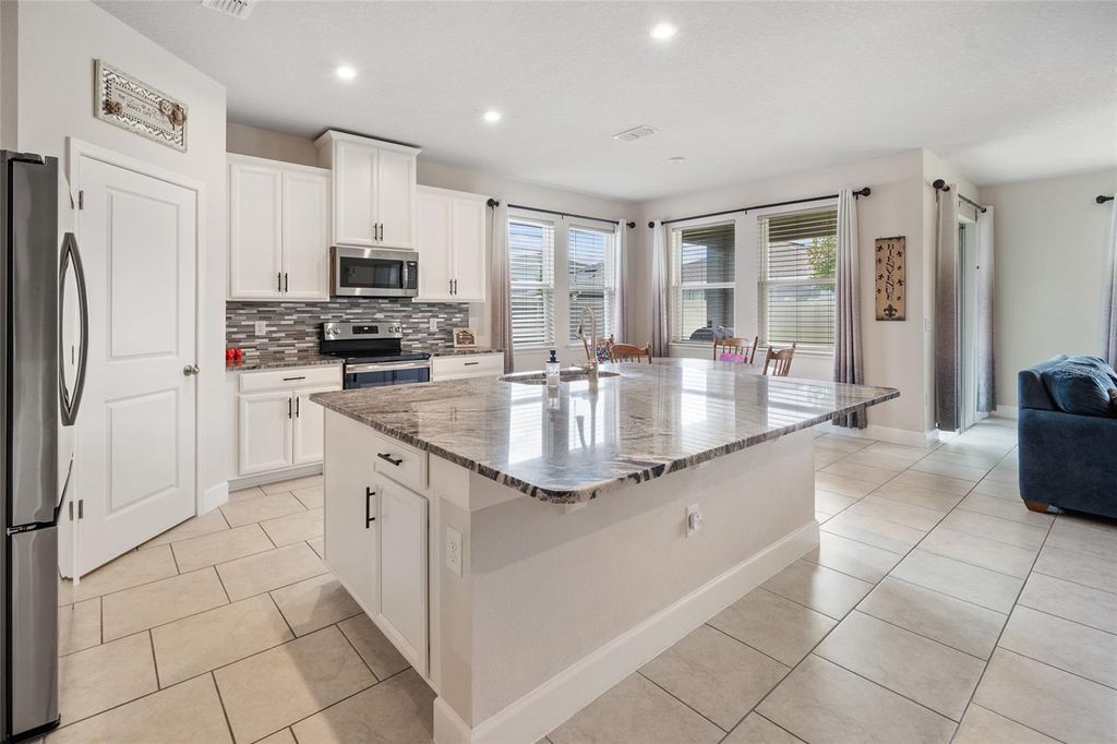 Photo of 584 Seattle Slew Drive, Davenport, FL 33837 (MLS # O6419621)