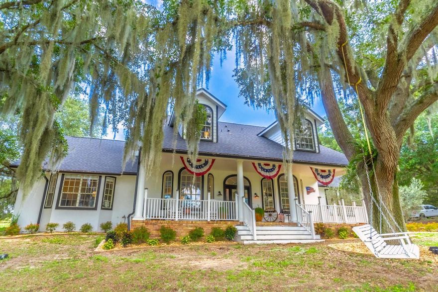 Auction Property. LIST PRICE IS FOR MLS PURPOSES ONLY. ACTUAL PRICE WILL BE DETERMINED AT AUCTION. ONLINE AUCTION ENDS MAY 7 AT 1 PM ET. Tucked down a private, gated driveway on 11.27± acres near Umatilla, FL, this five bedroom, five bathroom plus two half bath estate home offers a rare blend of "Old Florida" seclusion with mature oak trees and modern luxury. The expansive front porch, with sweeping high on the hill views, welcomes you into the tasteful home, which spans 3,879± sq. ft. of living space with over 7,300± sq. ft. under roof. Built in 1992, this residence was extensively renovated in 2021± with a new roof, Pex plumbing, and premium flooring throughout. Designed for privacy, every bedroom is a dedicated en-suite retreat. The primary suite serves as a true sanctuary, featuring a designer walk-in closet, a refined master bath, and ample storage. At the heart of the home, the open-concept kitchen boasts a custom 2021± remodel with dedicated coffee bar, farmhouse sink, and stainless-steel appliances. This flows seamlessly into the living room, with a fully functional wood burning fireplace, and dining room; double sliding glass doors lead out to a resort caliber pool and patio. The cozy family room boasts an additional sliding glass door with pool views and access to the two-car garage. Main level dedicated laundry room hosts newly installed cabinetry and outdoor access. The backyard oasis is anchored by a screen enclosed, 9± foot deep pool with a dramatic rock water feature, a fire pit, and new grilling area. Security cameras are installed throughout both the exterior grounds and the interior of the home. This property is a functional homestead ready for immediate use, featuring a new 720± sq. ft. pole barn, an irrigated garden, mature fruit trees, and established pens for chickens, sheep, and pigs. Infrastructure is robust, supported by a 180± foot deep well and a reverse osmosis drinking water system. Three HVAC zones, including two units replaced in 2021±, and a 4-ton unit that has been professionally serviced every year. Dedicated propane lines installed in 2021± service the kitchen stove, clothes dryer, and the outdoor grilling area via a leased tank. A pool enhancement in 2023± included a new high-efficiency variable-speed pump and a complete repainting. On-site pool solar heater panels will be ready to provide energy-efficient pool heating with slight repair. The high-capacity 14-inch well system features a 2 HP submersible pump and an 85 gallon bladder tank for consistent pressure for the garden and interior. With no HOA or rental restrictions, this estate is perfectly suited as a private sanctuary, a hobby farm, or a high-end short-term rental. Located at the "Gateway to the Ocala National Forest," you are minutes from trails and springs, yet only 30± minutes from the historic charm of Mount Dora. Close proximity to the Harris Chain of Lakes, renowned globally for competitive bass fishing and accessible via nearby public ramps. Seller is a licensed FL real estate sales associate. Property #: DG26015. Bid Online April 30 - May 7. 10% Buyer's Premium. Subject to the final bid at the online auction and auction terms.