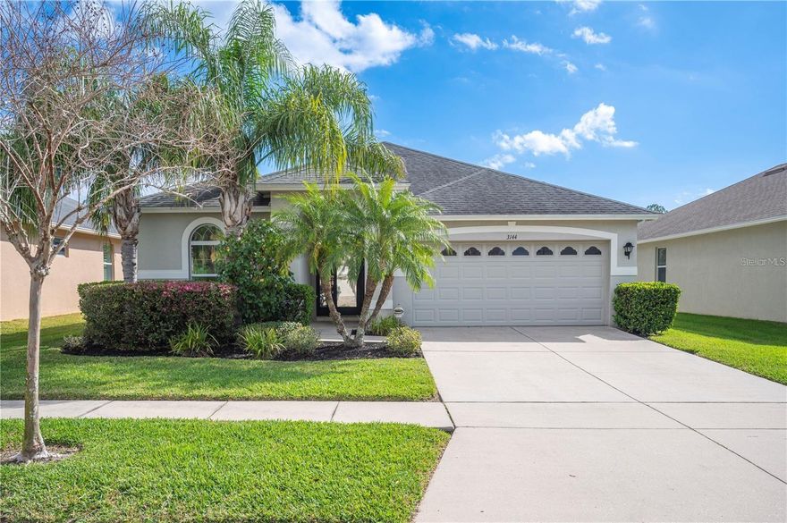 One or more photo(s) has been virtually staged. Welcome to this beautiful home in the highly sought-after, gated community of Stonegate. This meticulously maintained 3-bedroom, 2-bathroom residence offers a modern, open layout designed for both everyday comfort and elegant living. As you approach, you’ll be greeted by excellent curb appeal, highlighted by mature landscaping and an impressive 8-foot custom front door. Step inside to a spacious foyer with nearly 11-foot ceilings that open to a bright and airy great room. The open-concept design flows seamlessly into the stunning kitchen, featuring a large island with Corian countertops, rich Espresso wood cabinetry, stainless steel appliances, and a striking stone backsplash. The kitchen opens to the roomy great room, complete with large windows in the breakfast nook and sliding doors that lead to the backyard. Throughout the main living areas, you’ll find gorgeous wood-look ceramic tile plank flooring. The spacious primary suite includes two walk-in closets with custom built-ins, while the ensuite bathroom boasts granite countertops, dual vanities, Espresso cabinetry, and a large walk-in shower—creating a serene retreat at home. Step outside into your oversized fenced backyard, offering plenty of room for a future pool or other outdoor features. Perfectly situated just a short walk from playgrounds, the community pool, and a scenic waterfront fishing pier, this home combines comfort, style, and convenience. Stonegate is ideally located near A-Rated Schools, shopping, dining, and major access roads—making this the perfect place to call home.