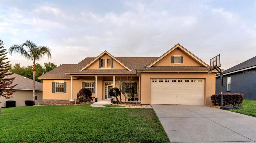 Quiet luxury meets superb quality in this STUNNING, 4 Bedroom, South Lakeland POOL home! Situated in a sought-after gated community, this Ernie-White Construction home offers charming features and a wonderful split floor-plan. The exterior curb appeal is outstanding, with a covered front porch, fresh exterior paint, shutters and nice landscaping. Attention to detail is evident throughout the home, with upgrades such as crown molding in the main areas and primary bedroom, a transom window framing the foyer, french doors to the office and additional trim details such as wainscoting in the living room, bead board in the dinette and chair railing in the office. Attractive tile flooring, appealing paint colors and updated fixtures add modern appeal to the transitional design. From the foyer, the front area of the home has two rooms that currently function as an office and a living area, but would serve as excellent flex spaces to suit your needs. A spacious family room with sliding doors to the porch serves as the heart of this home. The kitchen features granite countertops, white cabinetry, stainless appliances, a closet pantry, and a breakfast bar overlooking the family room and dinette. The primary suite is comprised of a large bedroom, two walk-in closets, and an en-suite bathroom with separate vanities, a soaking tub, shower, and water closet. Across the home there are three additional bedrooms and a very large guest bathroom with access to the pool. Serving as an extended living area, you will love the back porch with a covered seating area, large pool, screen enclosure, and a fully fenced yard with plenty of green space for gardening and play. The “Haven” light system adds ambiance and fun for daily living and entertainment, with options to synch lighting effects to your favorite music or sports teams! This home has a large private inside laundry room, nice closets and a 2-car garage, ensuring plenty of storage space. Located in South Lakeland, close to grocery stores, restaurants, parks, and excellent schools, all with easy access to the Polk Parkway, this location offers convenience and an excellent quality of life. There is so much this home offers, but above all else, this is a comfortable and welcoming place to live, and a wonderful space to entertain and experience special times with loved ones.