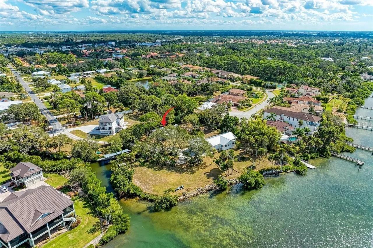 It’s an exclusive opportunity to build a luxury home on this 0.54-acre lot. The driveway and septic easements are recorded, the blueprints and engineering are ready to start a new construction. This land is for sale by a local builder, owner of OMKAL Construction, and it’s suitable for one, two or three-story home up to 3,300 s/f under air. You can choose OMKAL Construction, or you can purchase the lot and pick your own builder.
This property is right next to multimillion dollar homes and is second in line from the waters of Blackburn Bay. The beautiful Hammock Preserve, which is cleared and well maintained, is beside your backyard that gives you a feel of your own private park. Best school district with a walking distance to school bus stop or a 5-minute drive to Laurel Nokomis School (pre-K to 8th grade). The same bus stop is also used for Venice High School. It is located within the shopping centers; quick drive to the newly built Sarasota memorial Hospital; near the Nokomis beach and boat rentals at Gulph Harbor Marina; waterfront Restaurants and South Jetty Park. It is also a short drive to Laurel Park with access to Legacy Trail and 10 minutes away from Sarasota, which gives you a great option to work or enjoy the city and yet come back home to a peaceful place without any traffic. The vibrant charm of Downtown Venice is just a few minutes away.
This property located in a nice neighborhood where you can walk your dog, ride a bike, or simply enjoy the sunsets and fresh breeze from the Gulf of Mexico.
The front entry driveway can be widened twice the width at the time of construction by removing the pine trees and supporting poles.
It is a vacant lot and blueprints and pictures of a new construction shown are one of the possible choices of what can be built on this property.