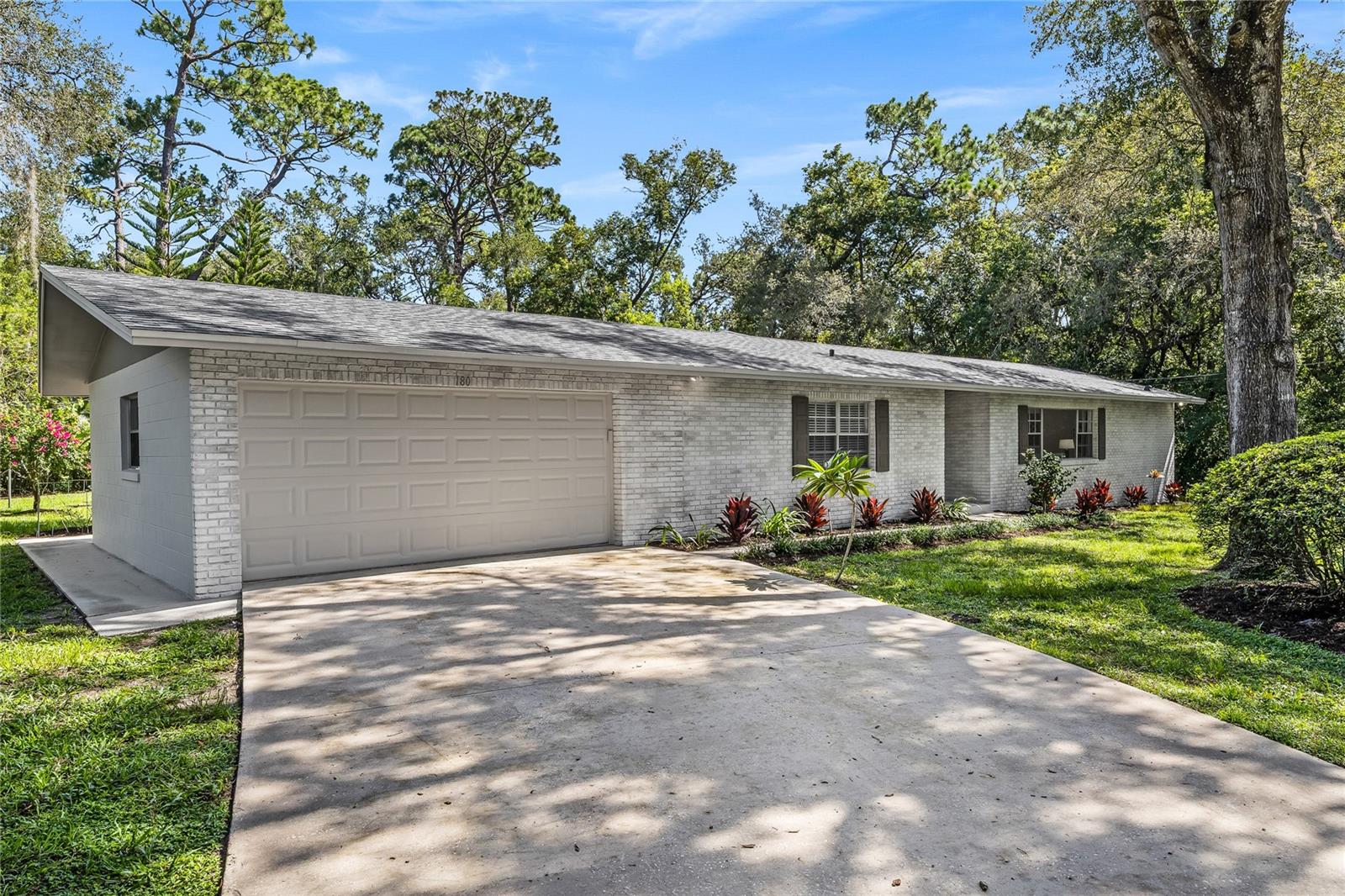 A rare opportunity – BEAUTIFULLY RENOVATED home situated on a DOUBLE-LOT in a NON-HOA area right in the heart of Lake Mary, Florida. 4-bedrooms, 3-bathrooms, three-way split floorplan with open living/dining room and separate family room layout offers a multitude of living options. Home ownership’s most expensive investments have all been addressed: NEW ARCHITECTURAL SHINGLE ROOF (2025), COMPLETELY NEW SEPTIC TANK & DRAINFIELD (2025), HVAC SYSTEM (2022), NEW RHEEM HOT WATER HEATER (2025). JUST IMAGINE: NO HOA FEES AND NO SEWER BILL!! Add a solar array in your oversized (OVER 1/3 ACRE) backyard and you’re practically “living off the grid”!!
Sunshine State Home’s renovation team is known for choices that appeal to today’s discerning homebuyer. White shaker cabinetry (with 42” uppers) and quartz countertops in this re-imagined kitchen design which includes a new Frigidaire stainless steel appliance package. Luxury vinyl plank flooring, neutral paint pallet and modern exterior paint combine to offer peace of mind and a stylish living environment for years to come.
THROUGHOUT THE HOME: new lighting, new fans, new switches & outlets, new matte-black door hardware and updated 5 ¼“ baseboards make this Lake Mary ranch feel authentic and modern at the same time. Oversized patio is accessible via multiple slider doors. Bedrooms 2 & 3 share a full-bath off the rear guest wing, perfect as a future pool-bath with a backyard big enough to accommodate a swimming pool, toy-storage, or a true pet paradise.
Bedroom #4 is a perfect IN-LAW SUITE with it’s own dedicated full bathroom suitable for a multi-generational living situation. An additional value-added room (accessed off laundry/hall) is ideal as a fitness space, crafting/hobby room, holiday/overflow space or dry-goods storage area. The efficiency, character and charm this home offers is just not available in today’s “cookie-cutter” developments.