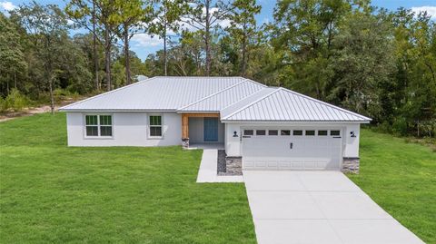 Photo of 12881 SW 95th Place, Dunnellon, FL 34432 (MLS # OM708596) Photo of 12881 SW 95th Place, Dunnellon, FL 34432 (MLS # OM708596)
