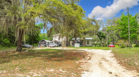 Photo of 15415 SE 64th Place, Ocklawaha, FL 32179 (MLS # TB8496552)