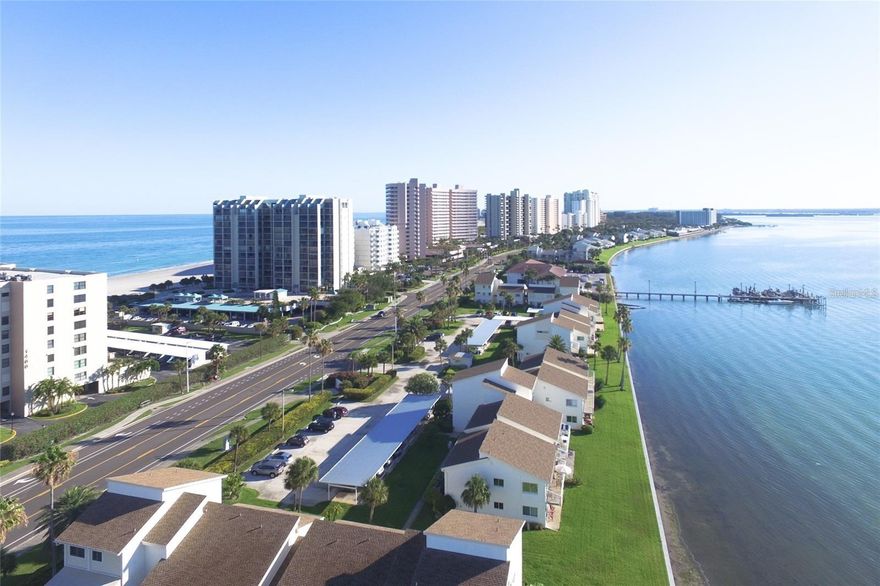 A beautifully updated 1 - bedroom, 1.5 bath condominium in the desirable Sand Key area, perfectly positioned on the intercoastal waterway with wide open water views from the living area and patio. Relax and enjoy sunrise over the water from your private outdoor space. The patio allows you relaxed lounging while watching boats and wildlife go by. Direct access to waterfront living and breezes that define the coastal lifestyle. Cross Gulf Blvd and you're at the sugar - Like Sand Key beach - perfect for swimming, walking or sunsets. Assigned covered parking space #11 sheltered and convenient. Sand Key Plaza - walking distance to Columbia Restaurant, Backwaters, cafes, and great clothing stores.