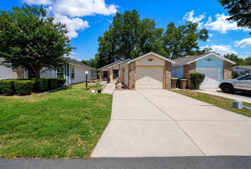 Beautifully maintained 3 bedroom, 2 bathroom, 1-car garage home located in the desirable community of Wellington Station that features a pool and clubhouse. This move-in ready home features an open split-bedroom floor plan with luxury vinyl plank flooring in the living areas, tile in the kitchen and bathrooms, and carpet in the bedrooms. The spacious kitchen offers plenty of cabinet space along with natural gas for the range, water heater, and heating system. Recent updates include a newer roof and AC both replaced in 2014, plus freshly painted interior and exterior. Enjoy year-round relaxation in the enclosed screened patio with its own split-unit AC, along with an additional covered outdoor patio overlooking the fenced backyard. A beautifully cared for home offering comfort, functionality, and low-maintenance living in a fantastic Ocala location.