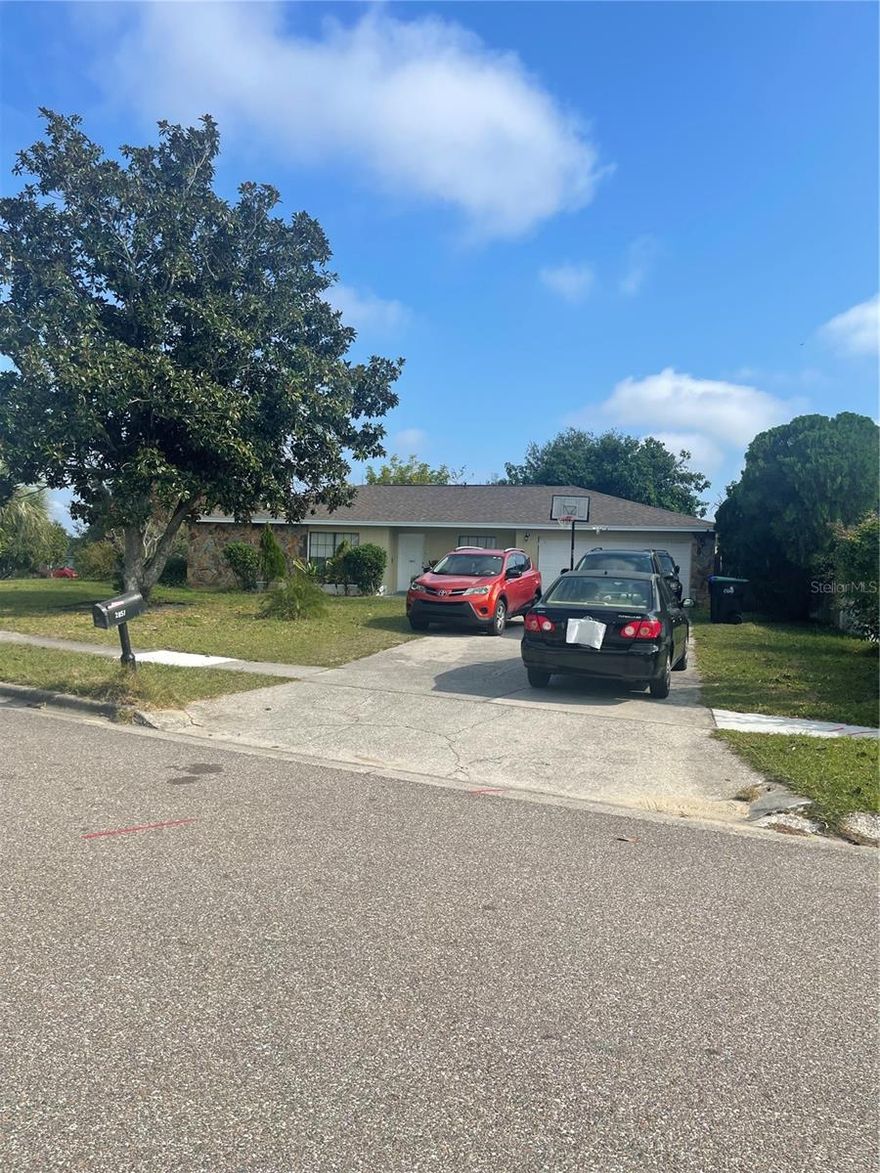 One of the largest homes in the area by far, sitting on a huge corner lot. These four bedrooms, two-and-a-half-bathroom home has plenty of space: formal living and dining room plus a large family room with vaulted ceiling and an eat-in kitchen. Feel the relaxed energy of the islands when you step onto the screened back patio. The master bedroom is bigger than most in the area, and has an added master bathroom which, alone, rivals the size of a standard bedroom. This master is equipped with a jacuzzi garden tub, a separate walk-in shower, as well as his-and-hers sinks & 2 walk-in closets. The split floor plan places the master bedroom on the opposite side of the home giving privacy from the other 3 bedrooms. The barstool kitchen counter highlights the openness of this amazing home.   THIS HOME IS A MUST SEE! This massive corner lot, on a quiet block, is large enough to play catch with friends and family. Come check it out, you will not be disappointed!