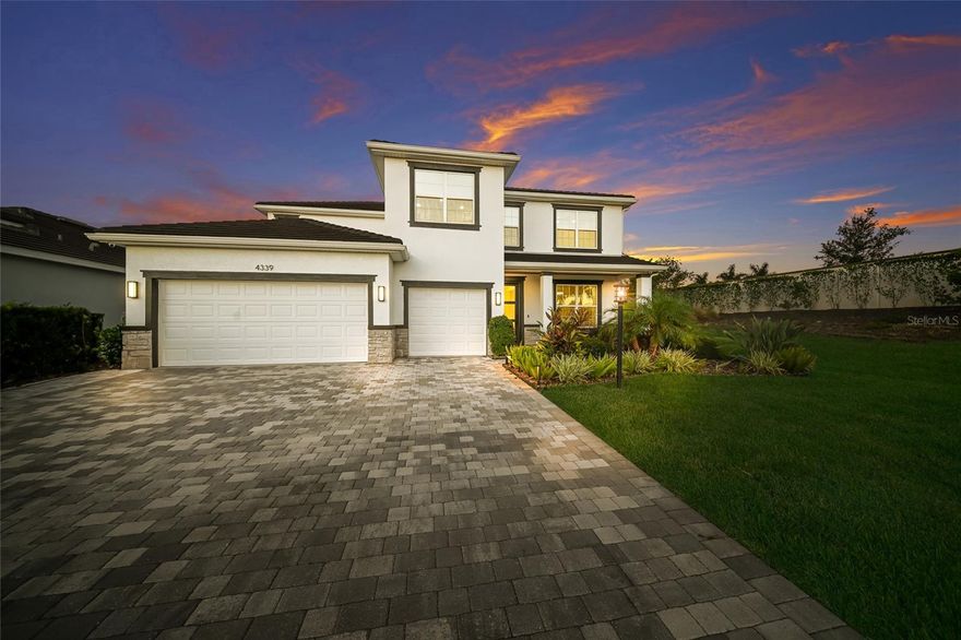 A MASTERPIECE OF CUSTOM LUXURY IN STAR FARMS! *** Prepare To Be Blown Away By 4339 Silo Port, An Extremely Rare Opportunity To Own The Highly Coveted Emerald Series Jordyn Model. Because This Floor Plan Is No Longer Available From The Builder, This Is A Truly Unique Find! This Home Is Massively Upgraded In Every Single Room, Offering A Level Of Sophistication You Have To See To Believe. *** EXTRAORDINARY FIRST IMPRESSIONS: The Luxury Begins Before You Even Step Inside With A Custom Upgraded Front Entry. Once Indoors, You Are Greeted By A Stunning Designer Office Complete With A Large Custom Shelving Unit And Upgraded Designer Lighting. *** A TRUE CHEF'S DREAM KITCHEN: The Entire Kitchen Has Been Completely Replaced And Reimagined! It Features High-End Wall Ovens, A Sleek Cooktop, And Stunning Waterfall Edge Countertops. The Luxury Seamlessly Continues Into The Dining Area With A Large Custom Wine Bar, Plus A Must-See Custom Built Butler’s Pantry. *** CUSTOM LIVING SPACES: The Main Living Area Is An Entertainer's Dream, Showcasing A Custom Built-In Fireplace And Shelving Unit. You Will Find Beautiful Accent Walls And Upgraded Designer Lighting In Almost Every Room Of The Home. *** FUTURISTIC GARAGE & MUDROOM: As You Enter The Home From The Garage, You Are Greeted By A Custom Mudroom And Drop Station. The Garage Itself Is Truly Something Special, Featuring Futuristic Custom Lighting That Simply Has To Be Seen To Be Believed! *** UPSTAIRS LUXURY & ENTERTAINMENT: Head Upstairs To Discover The Incredible Master Bedroom, Which Features Another Custom Fireplace Accent Wall. The Upgrades Do Not Stop There! The Upstairs Also Features A Fantastic Bonus Room Complete With A Projector And Large Screen That Are Completely Ready For Movie Night Or Hosting Your Next Big Sporting Event. *** RESORT STYLE OUTDOOR OASIS: The Outdoor Living Space Is Just As Spectacular As The Indoors. Relax Under The Custom Wood Accent Ceiling Or The Stylish And Functional Pergola for added covered Lanai space. Enjoy The Large Custom Pool, Spa, And Sun Drenched Tanning Ledge Complete With Ambient Lighting And A Bubbler. *** UNMATCHED LUXURY: I Cannot Even Explain All The Upgrades In This Home... You Just Have To Come Take A Look! Schedule Your Private Tour Today Before This Rare Jordyn Model Is Gone!