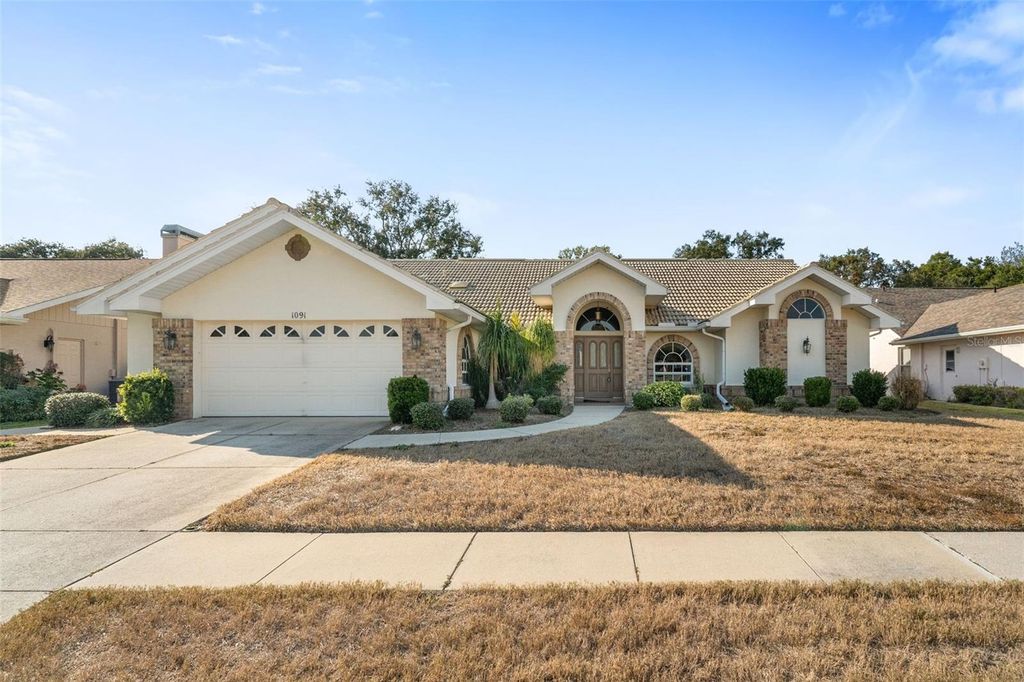 Photo of 1091 Tournament Drive, Spring Hill, FL 34608 (MLS # W7880793)