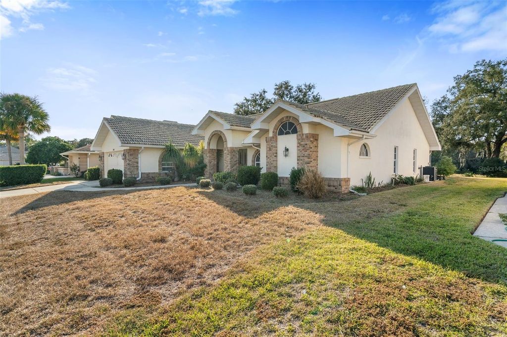 Photo of 1091 Tournament Drive, Spring Hill, FL 34608 (MLS # W7880793)